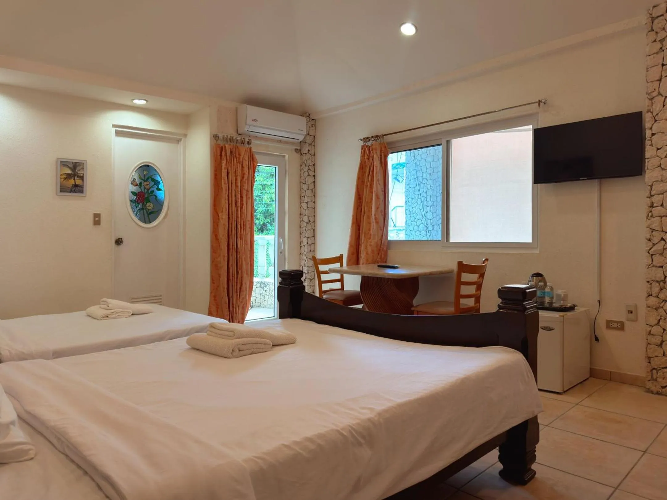 Photo of the whole room, Bed in Sunset Beach Resort