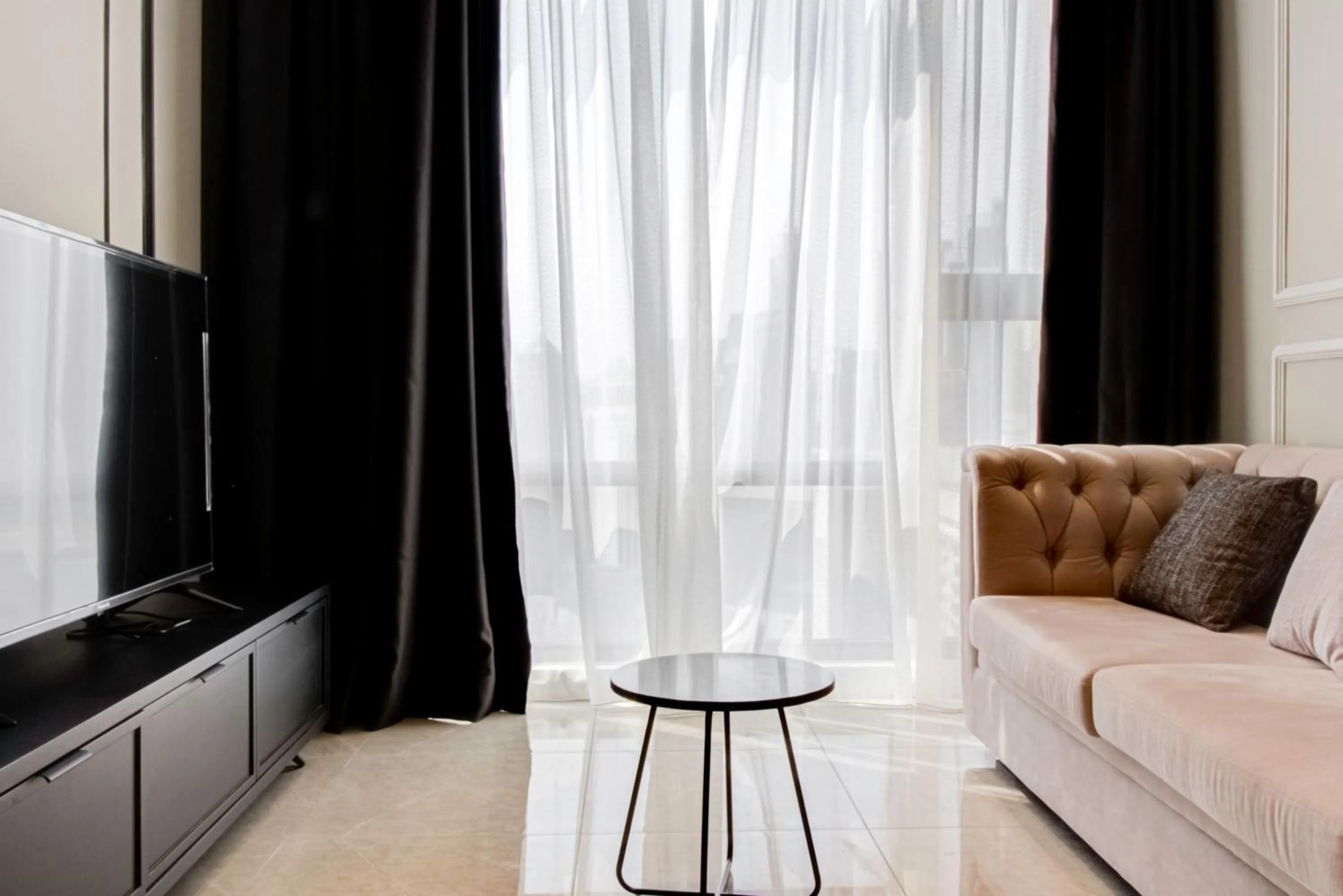 Living room in Axon Residence at Pavilion KLCC KL Tower view by KIMIRO