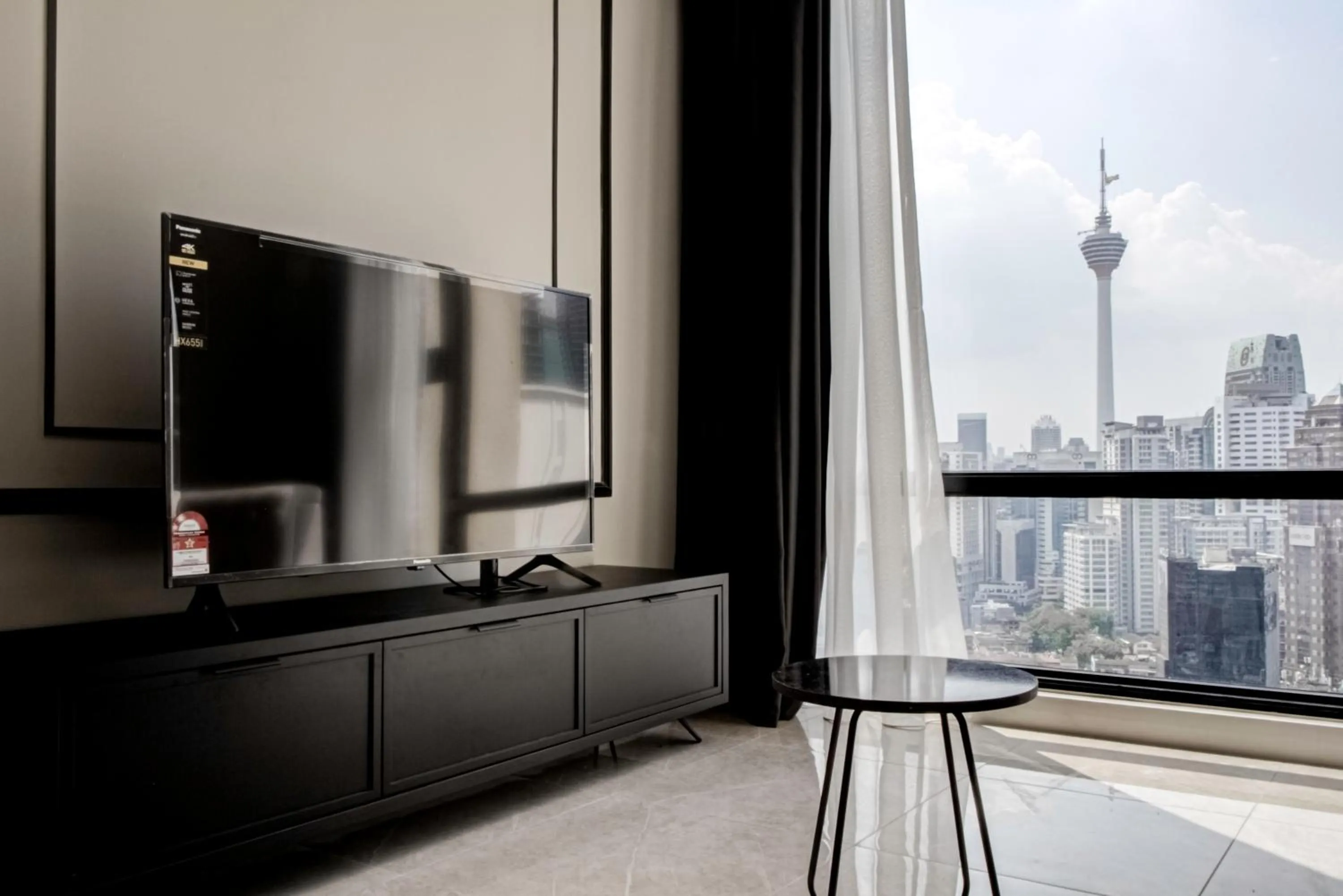 TV and multimedia in Axon Residence at Pavilion KLCC KL Tower view by KIMIRO