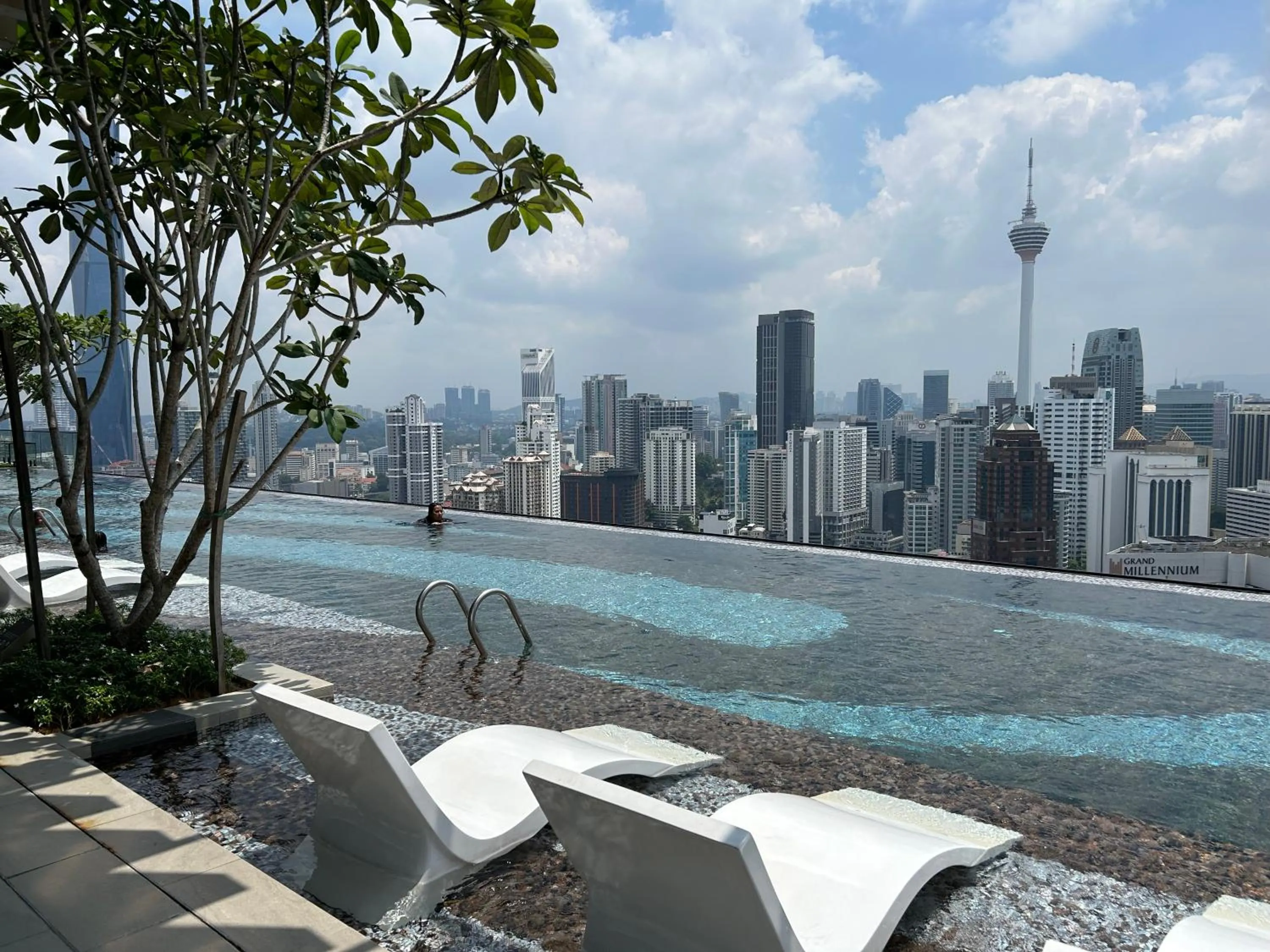 Swimming pool in Axon Residence at Pavilion KLCC KL Tower view by KIMIRO