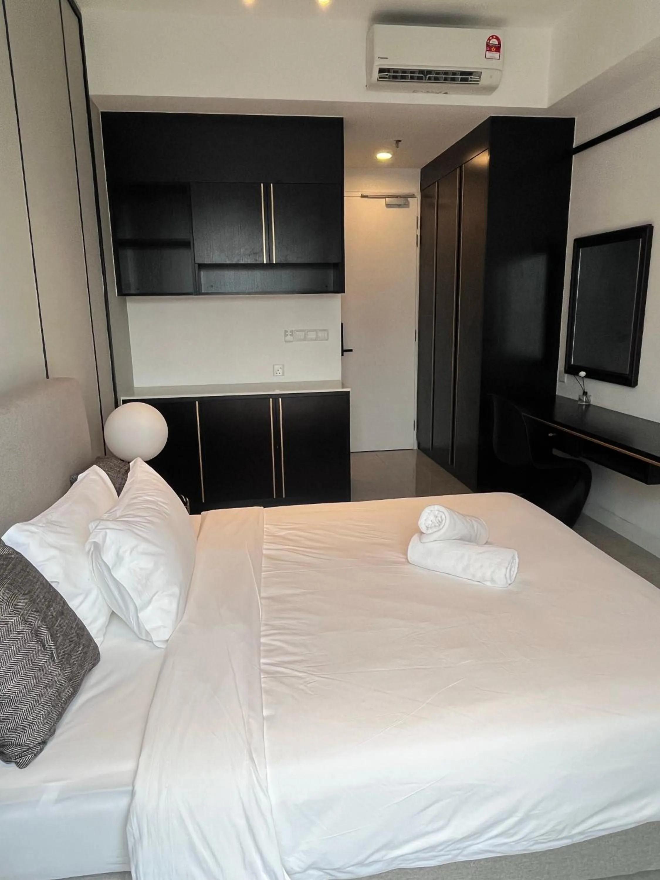 Bed in Axon Residence at Pavilion KLCC KL Tower view by KIMIRO