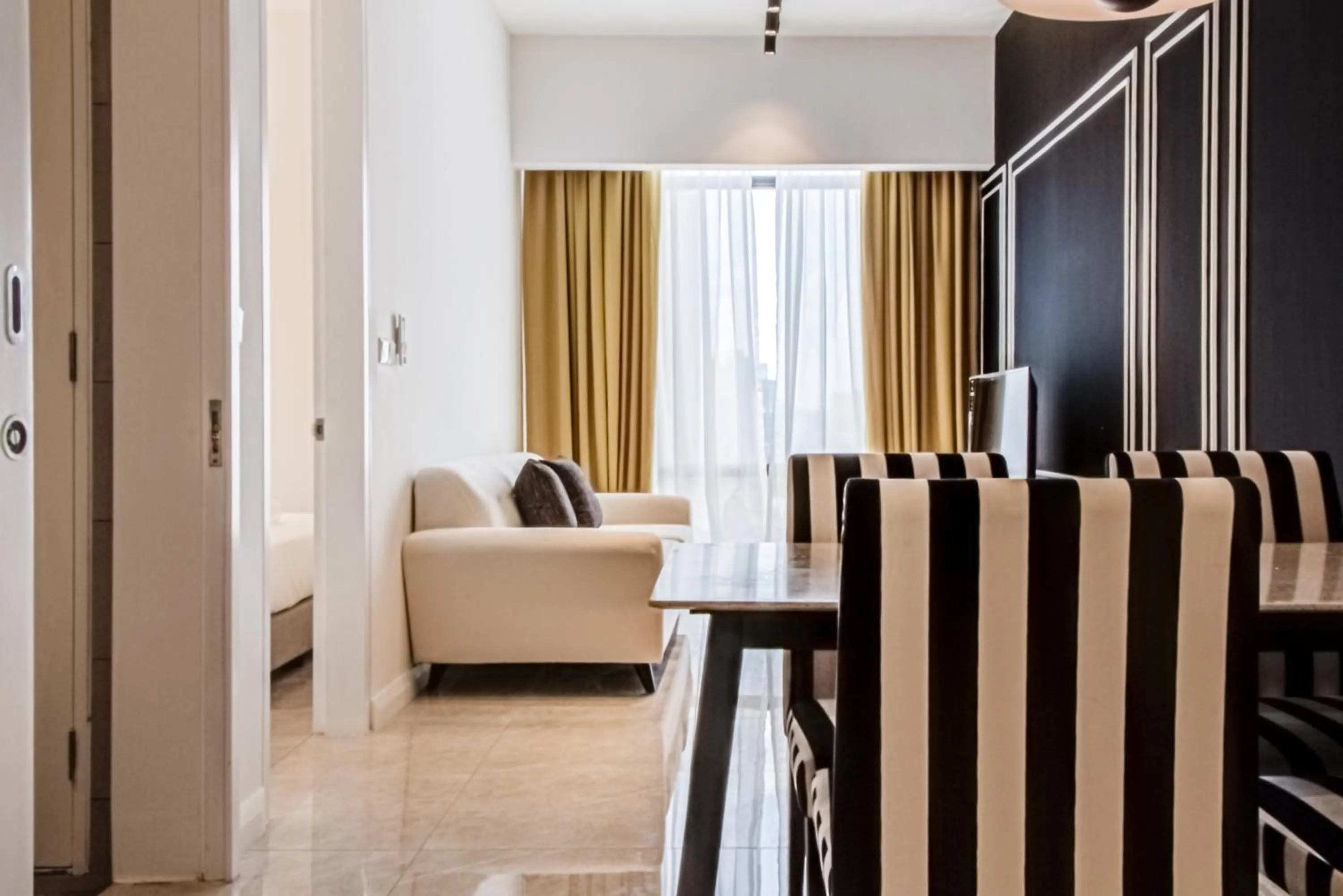 Living room in Axon Residence at Pavilion KLCC KL Tower view by KIMIRO