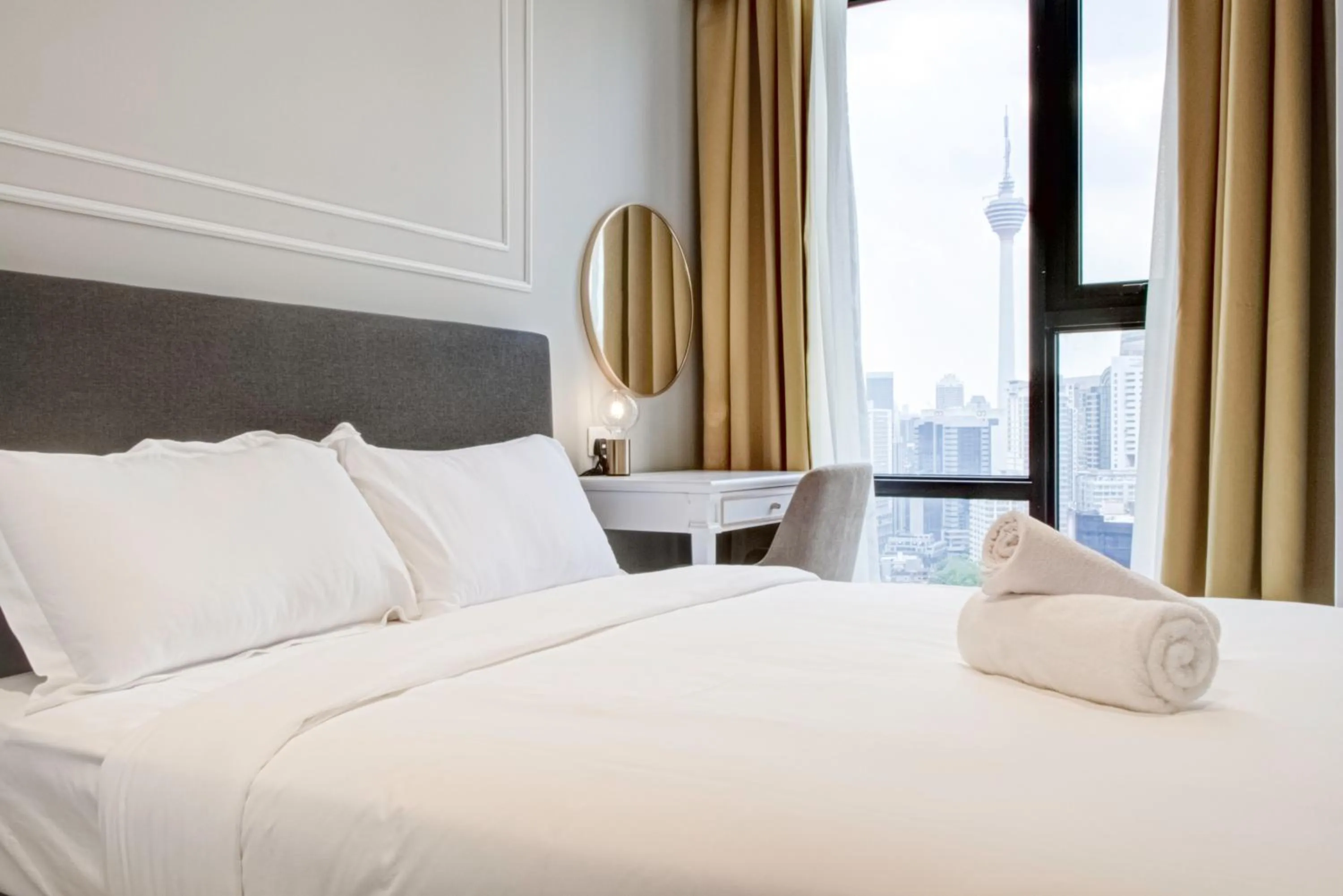 Bed in Axon Residence at Pavilion KLCC KL Tower view by KIMIRO
