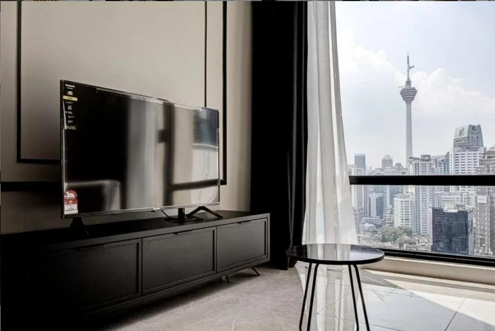 TV and multimedia in Axon Residence at Pavilion KLCC KL Tower view by KIMIRO
