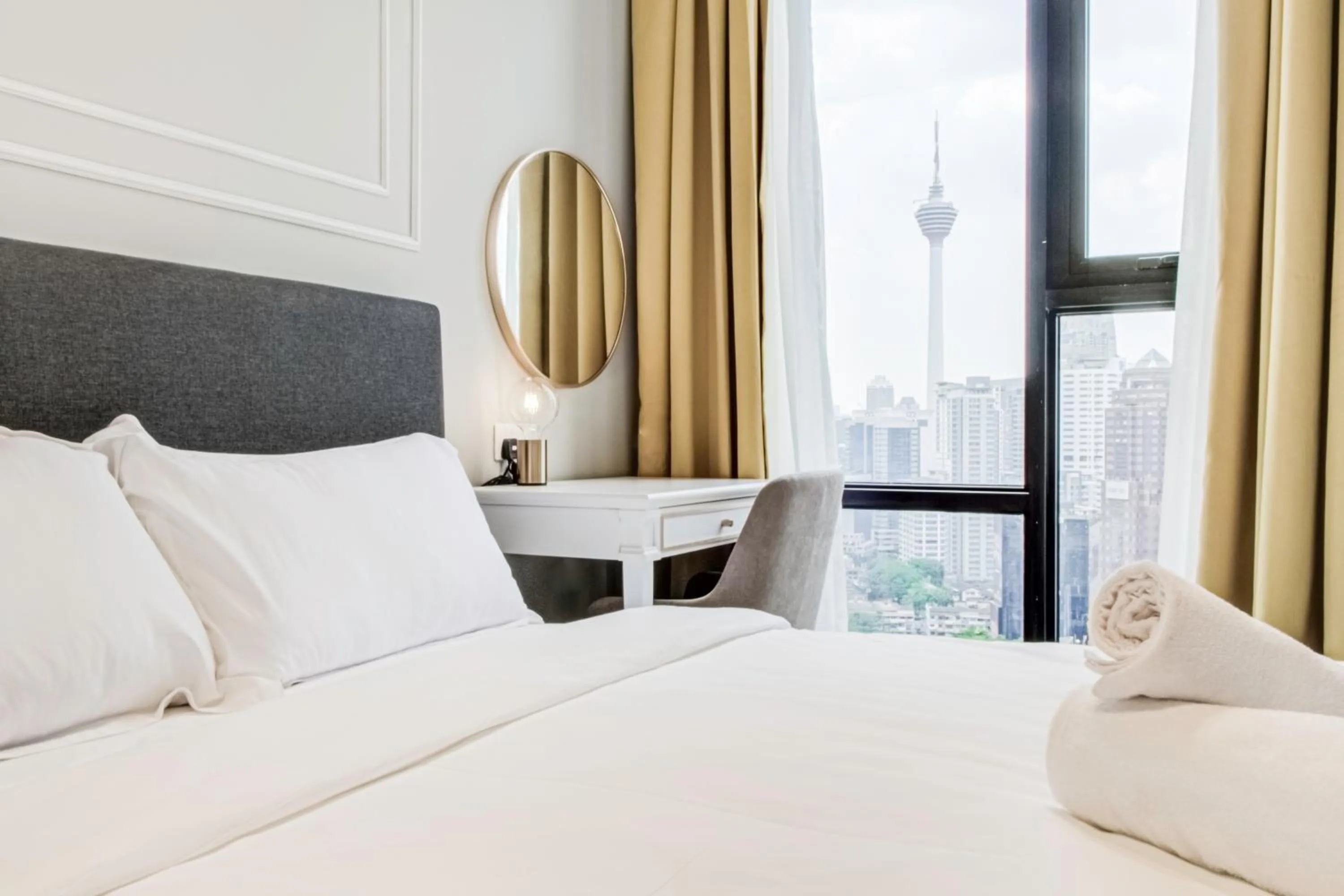 Bed in Axon Residence at Pavilion KLCC KL Tower view by KIMIRO