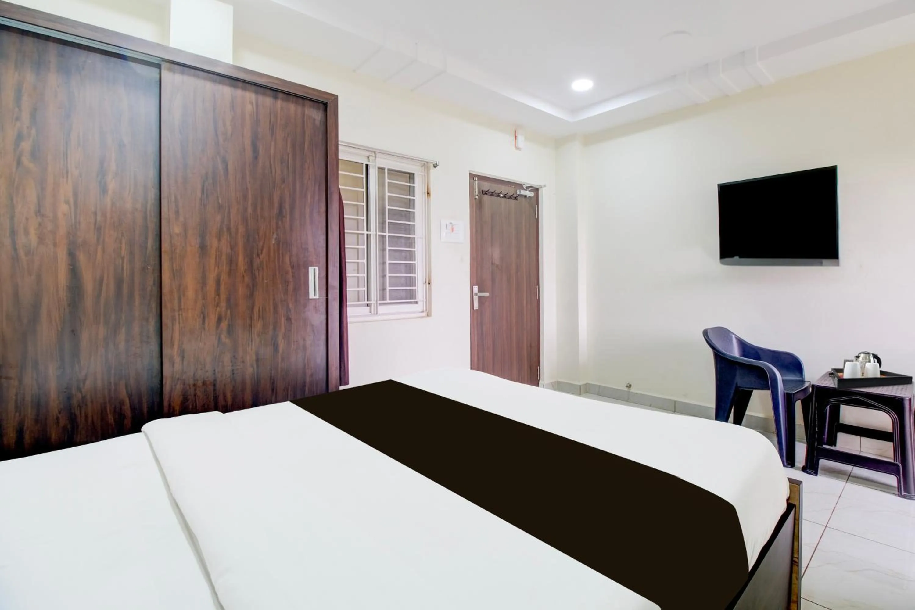 Bedroom, Bed in Super Hotel O Ramavarapadu Near PVR Icon