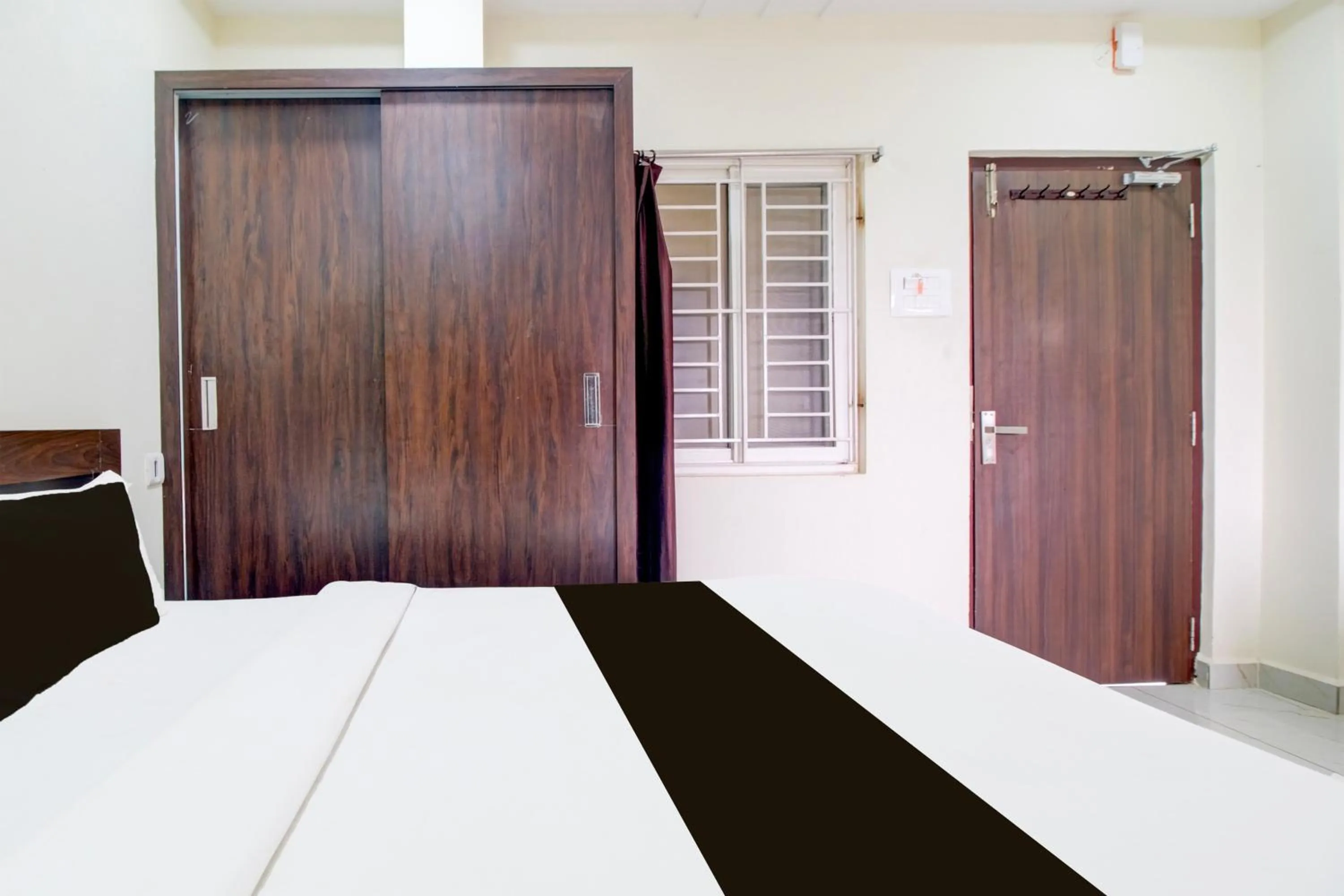 Bedroom, Bed in Super Hotel O Ramavarapadu Near PVR Icon