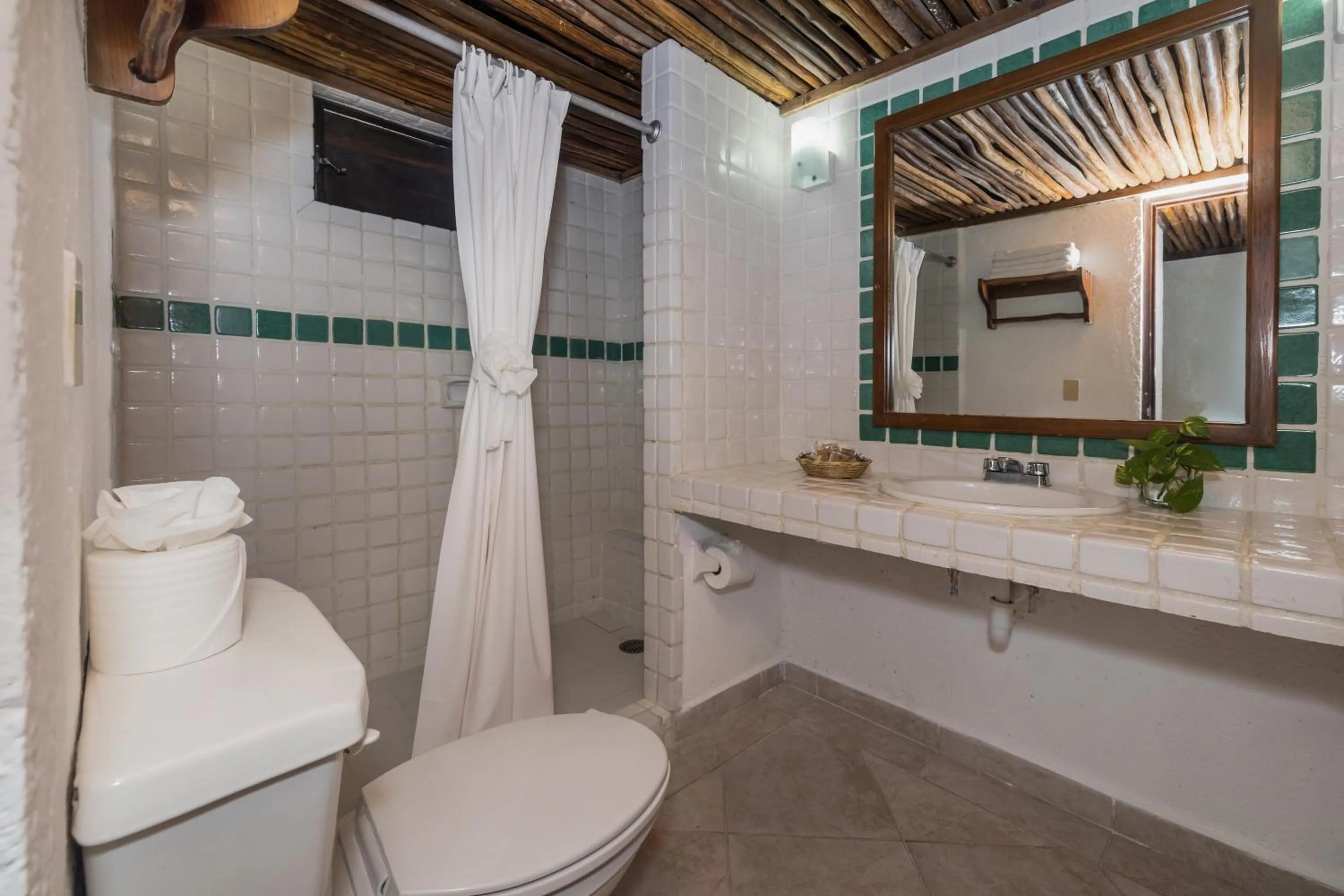Shower in Casa del Mar Cozumel Hotel & Dive Resort with free access to an exclusive beach club