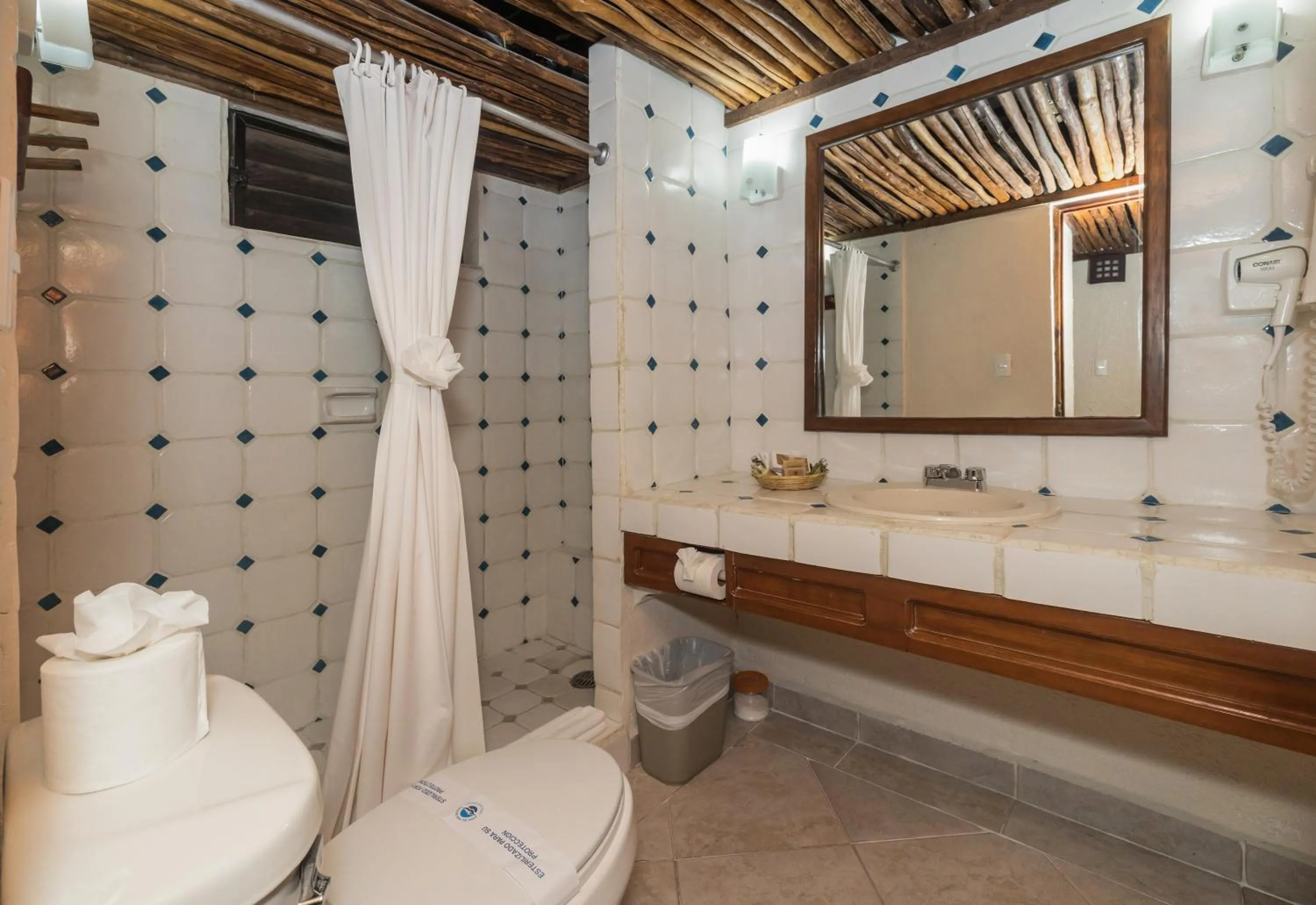Toilet in Casa del Mar Cozumel Hotel & Dive Resort with free access to an exclusive beach club