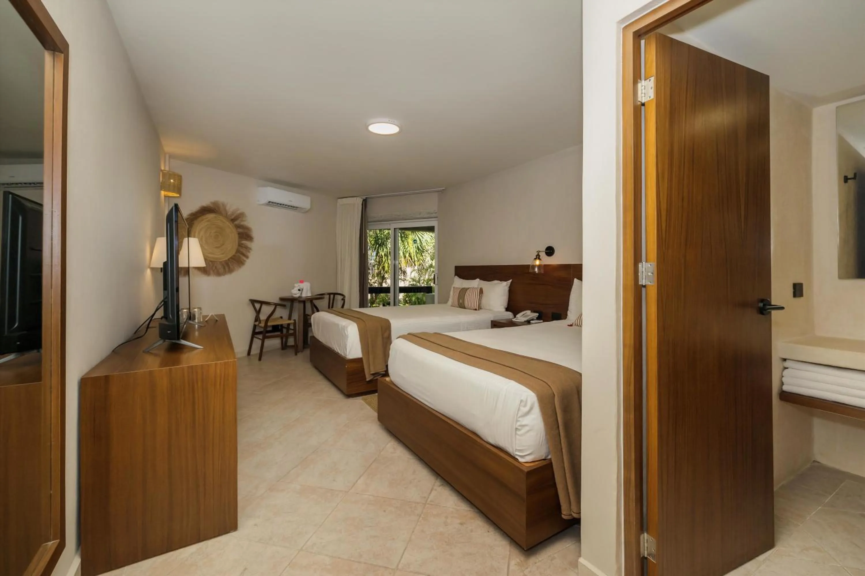 Bed in Casa del Mar Cozumel Hotel & Dive Resort with free access to an exclusive beach club