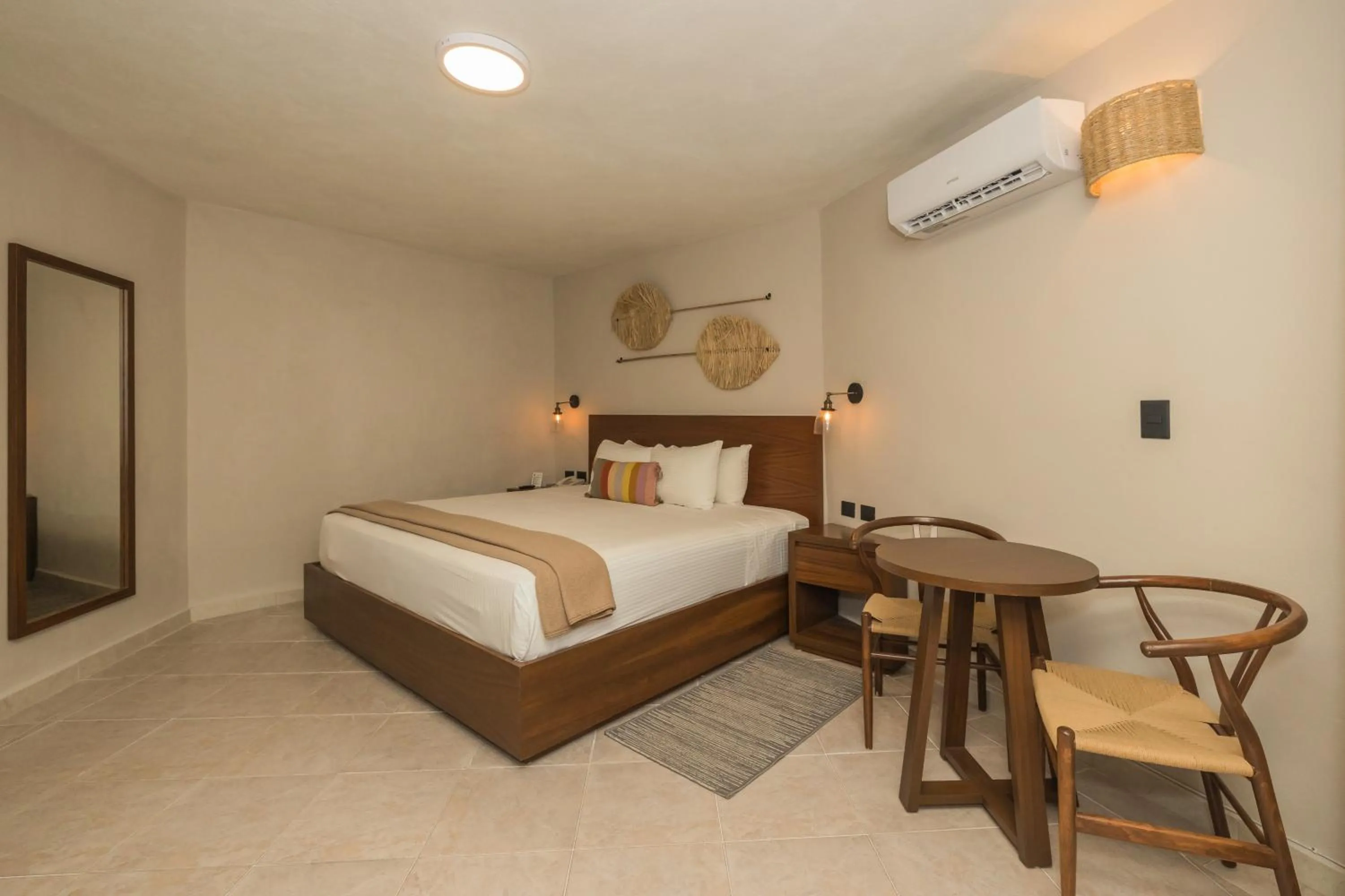 Bed in Casa del Mar Cozumel Hotel & Dive Resort with free access to an exclusive beach club