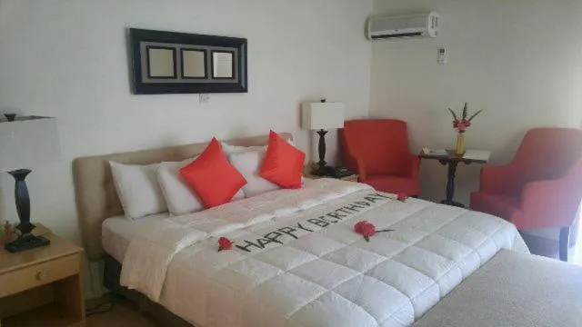 Bed in Sunset Shores Beach Hotel