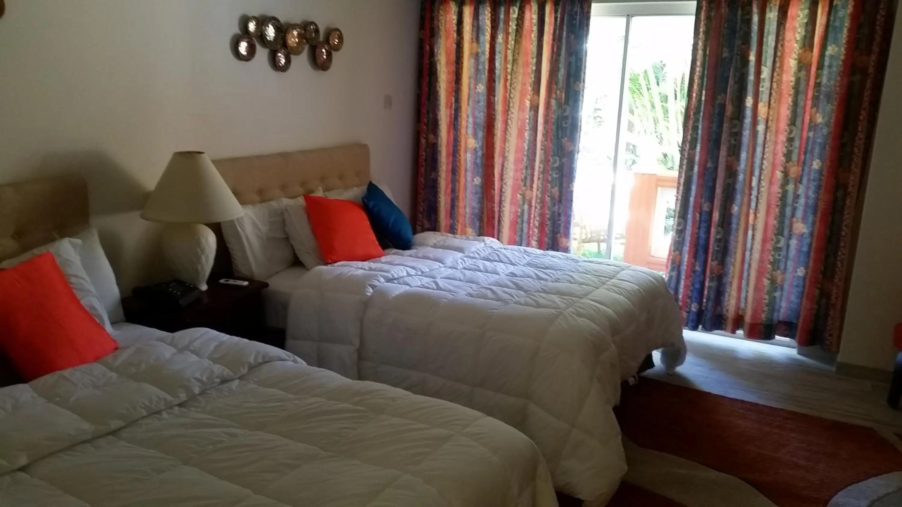 Bed in Sunset Shores Beach Hotel