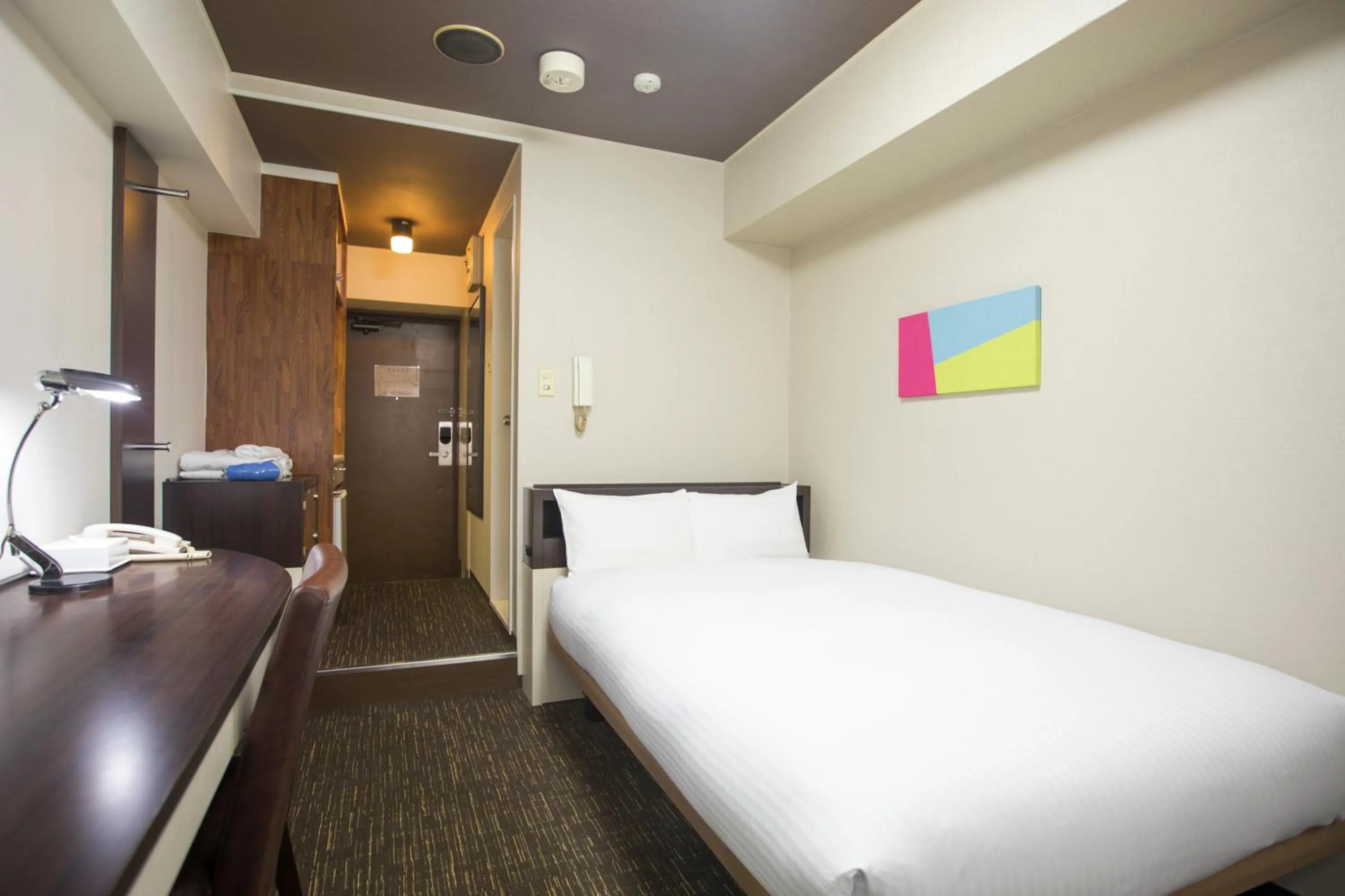 Bed in FLEXSTAY INN Kawasaki Kaizuka