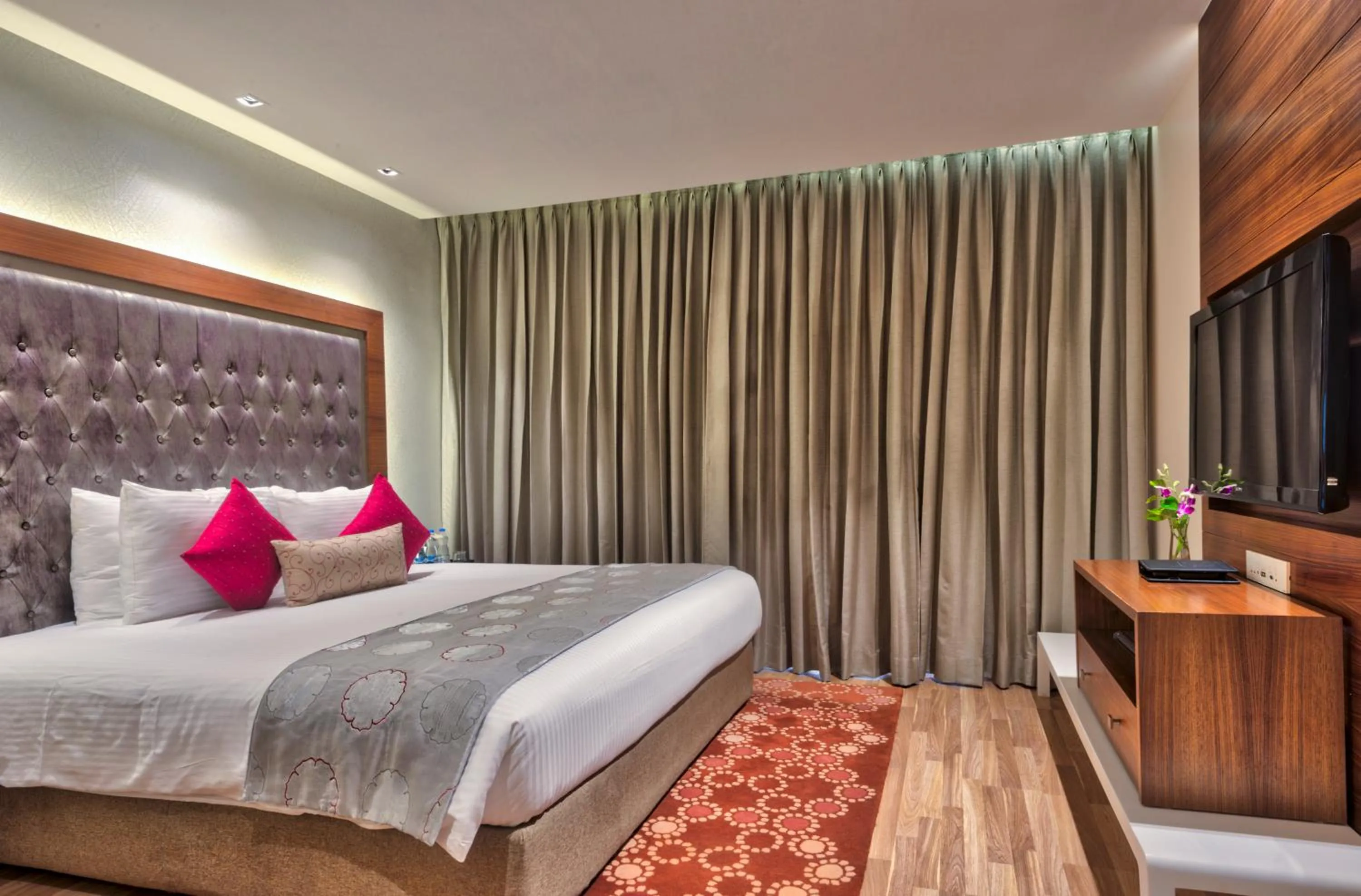 Bed in Grand Chennai by GRT Hotels