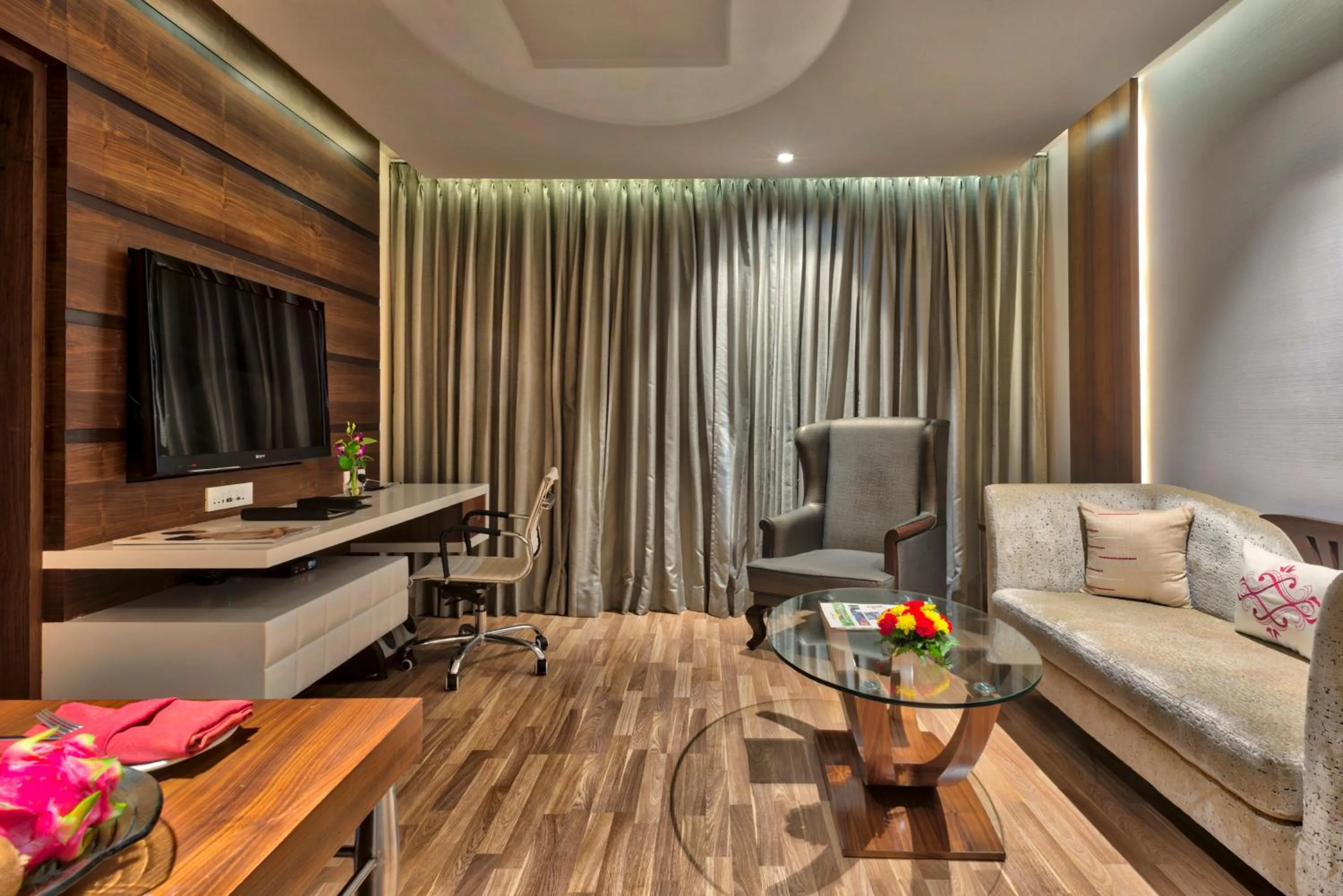 Living room in Grand Chennai by GRT Hotels