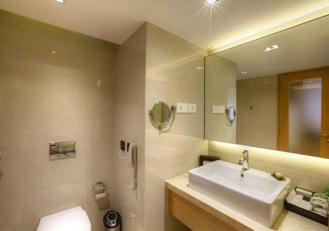 Bathroom in Grand Chennai by GRT Hotels