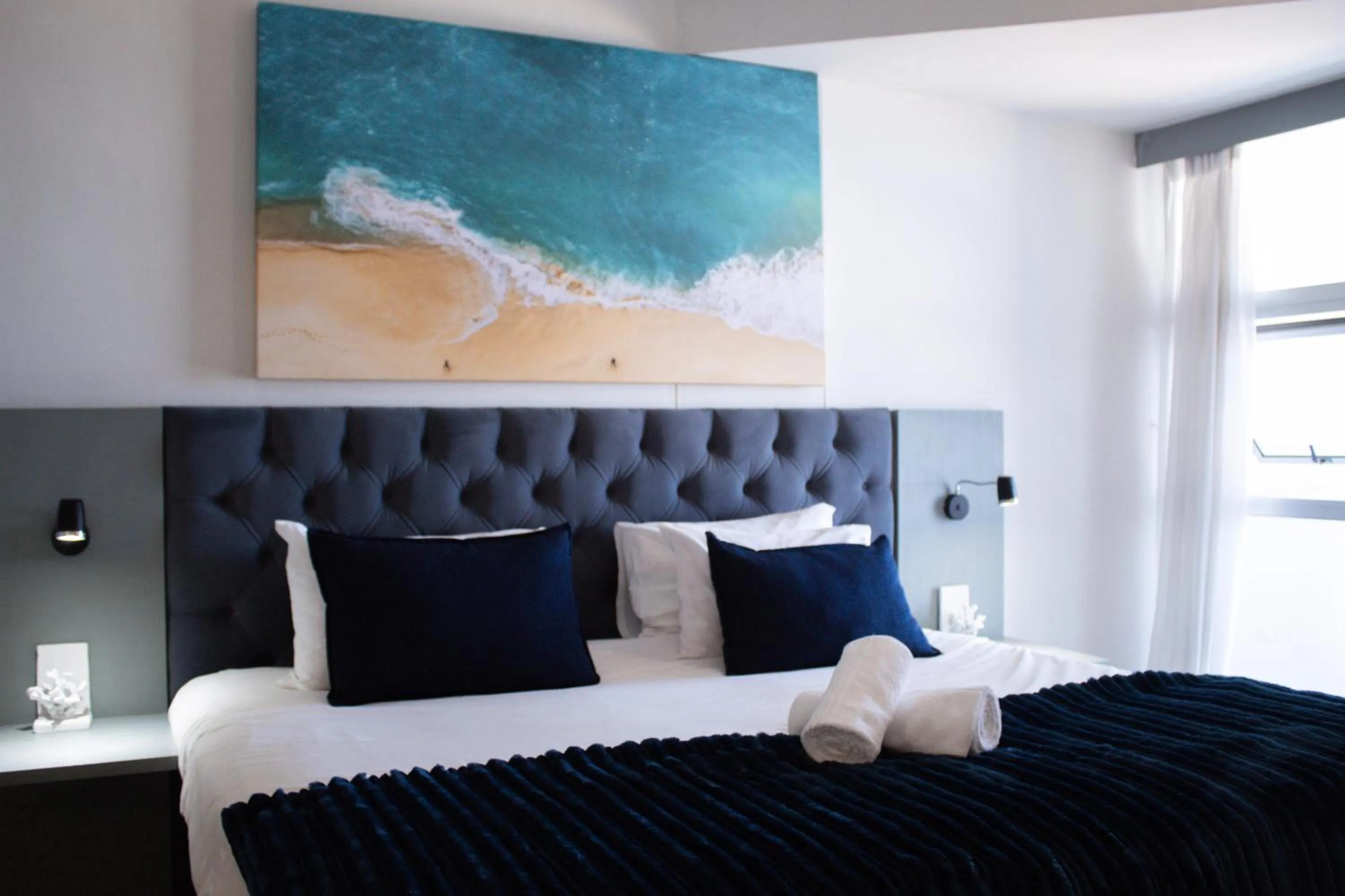 Bed in Ocean Breeze Hotel