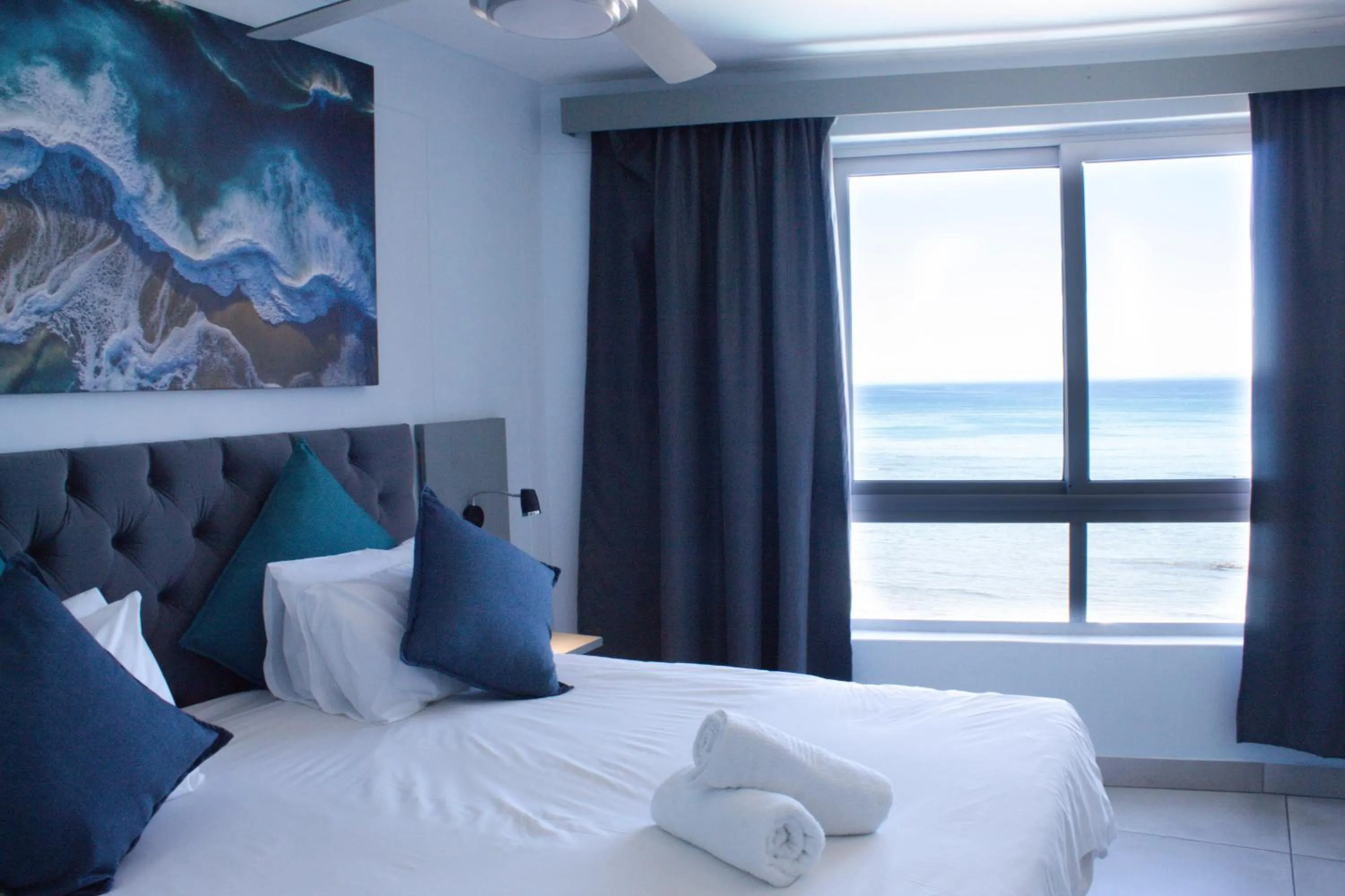 Bed in Ocean Breeze Hotel