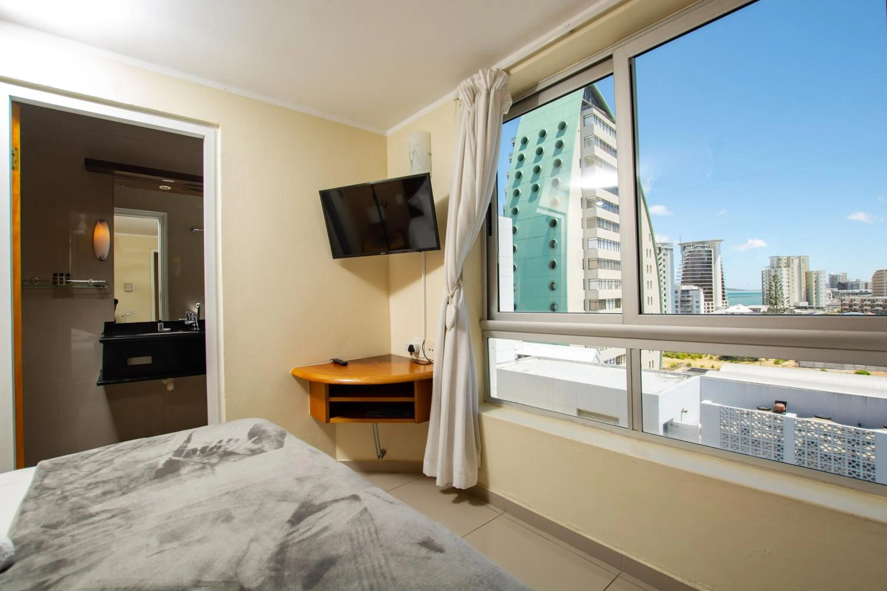 Bed in Ocean Breeze Hotel