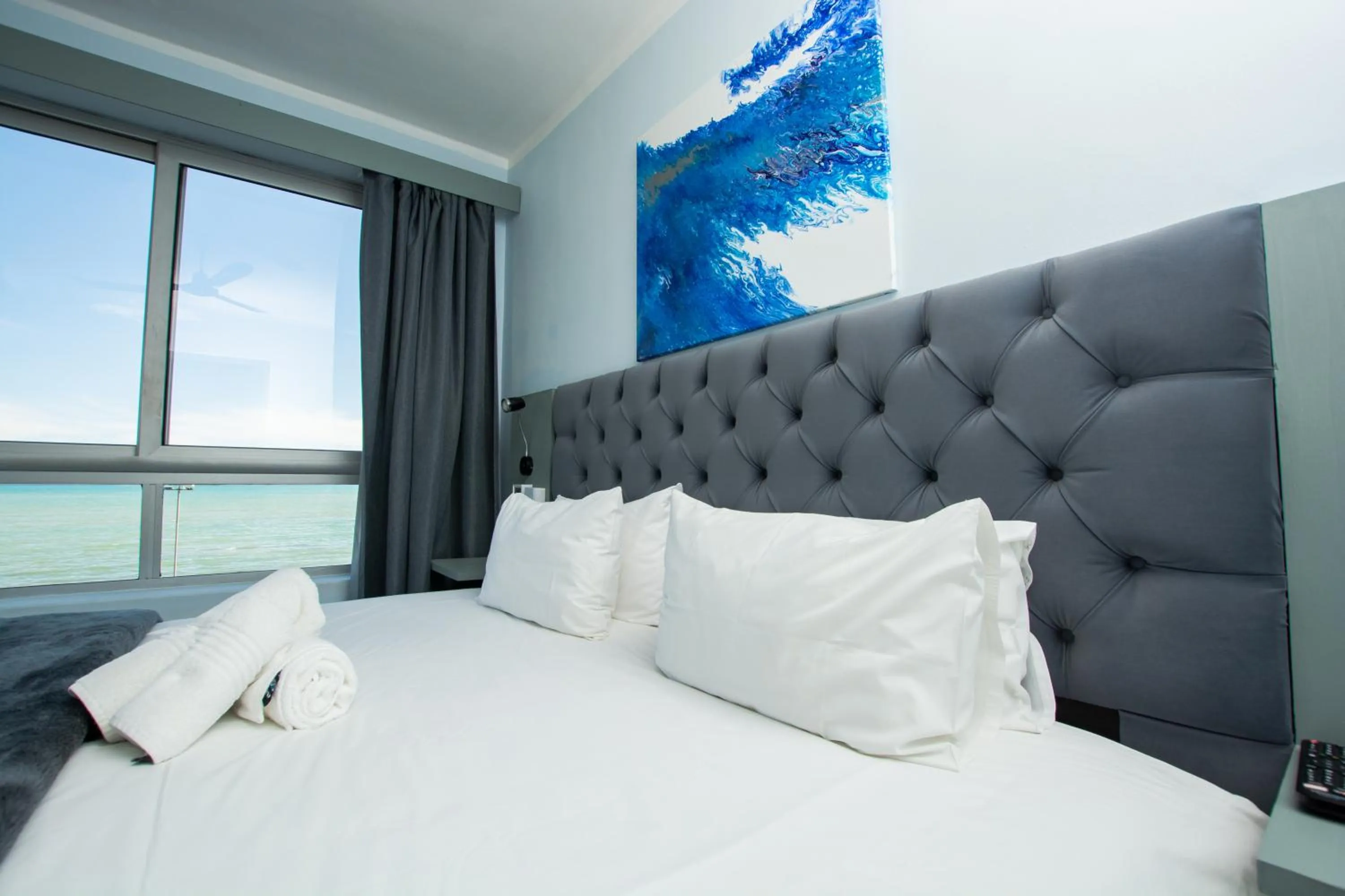 Bed in Ocean Breeze Hotel