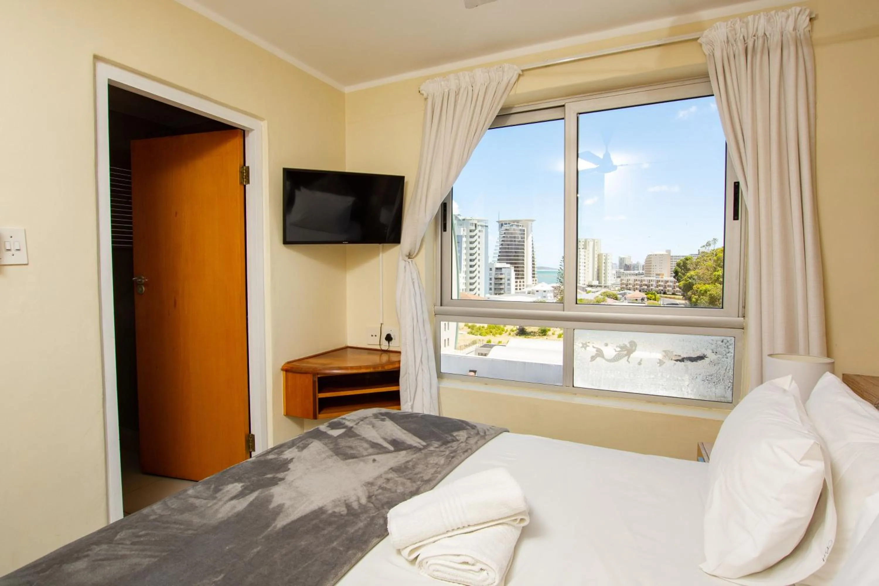 Bed in Ocean Breeze Hotel