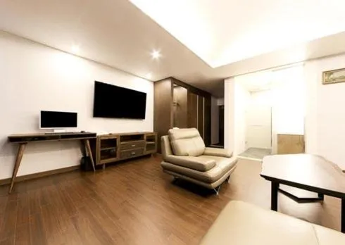 Communal lounge/ TV room in Yangsan Time Square Hotel