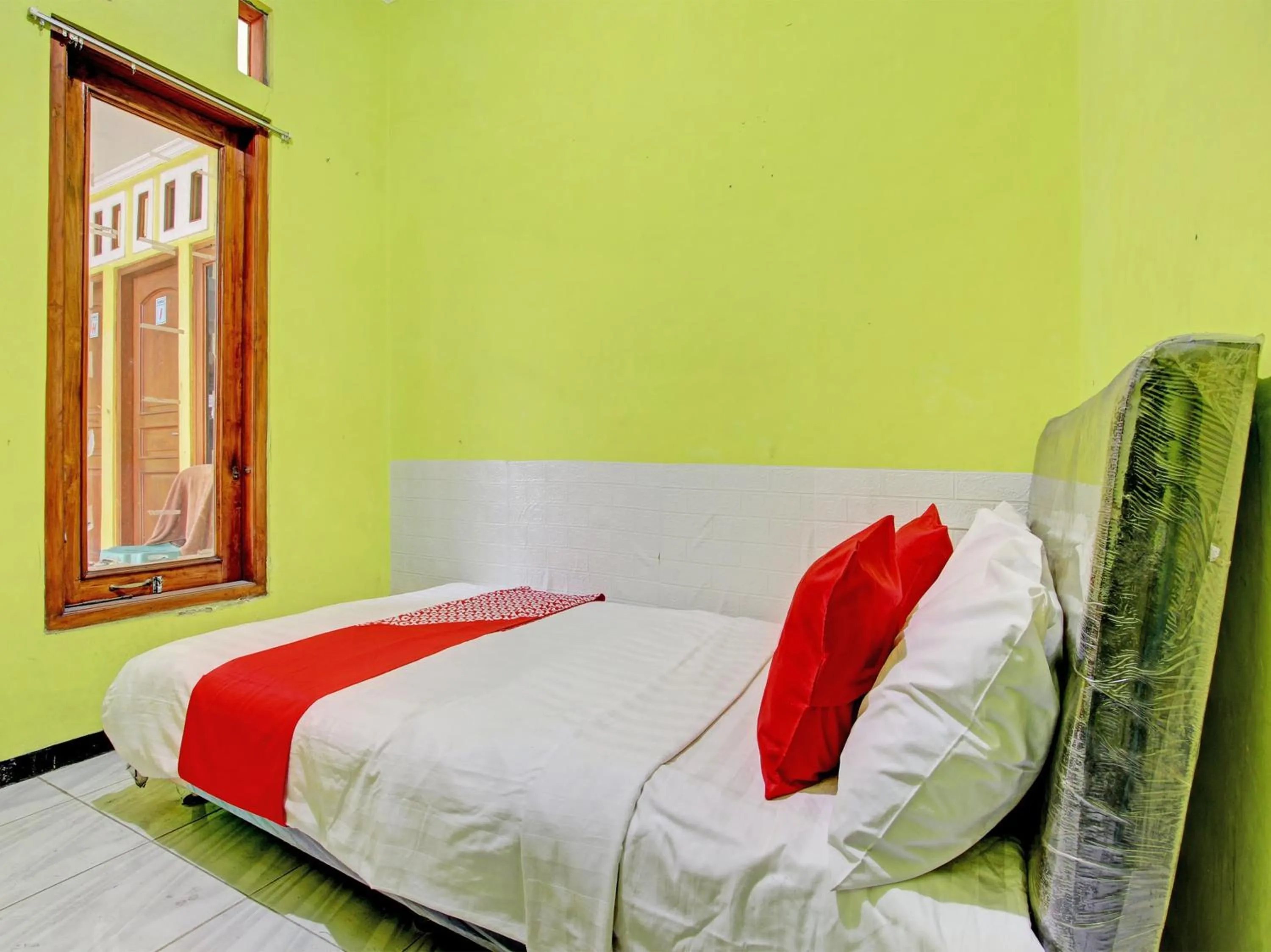 Bedroom in OYO 92998 Wiludjeng Guesthouse