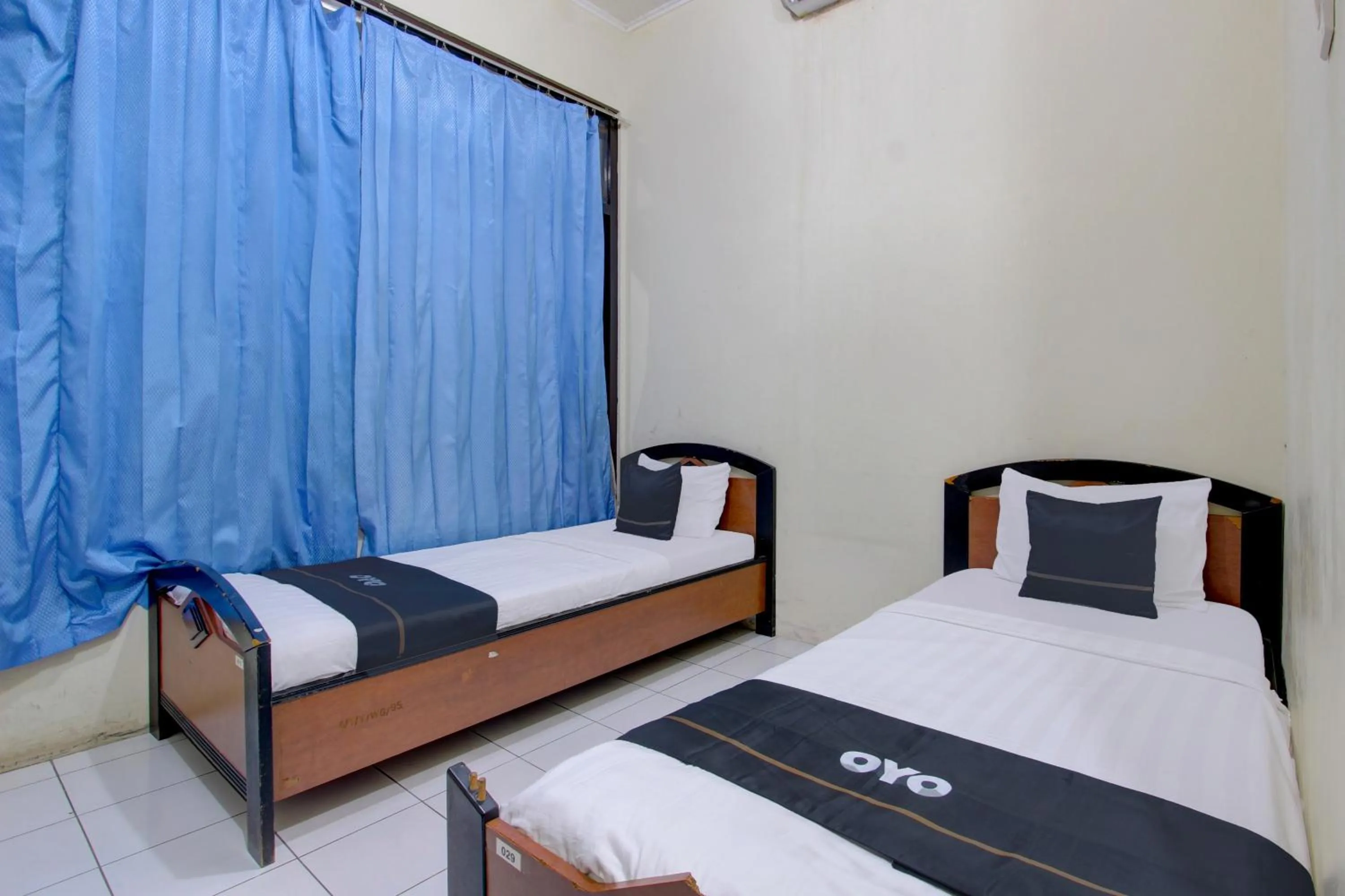 Bedroom in Capital O 93024 Hotel Ganesha