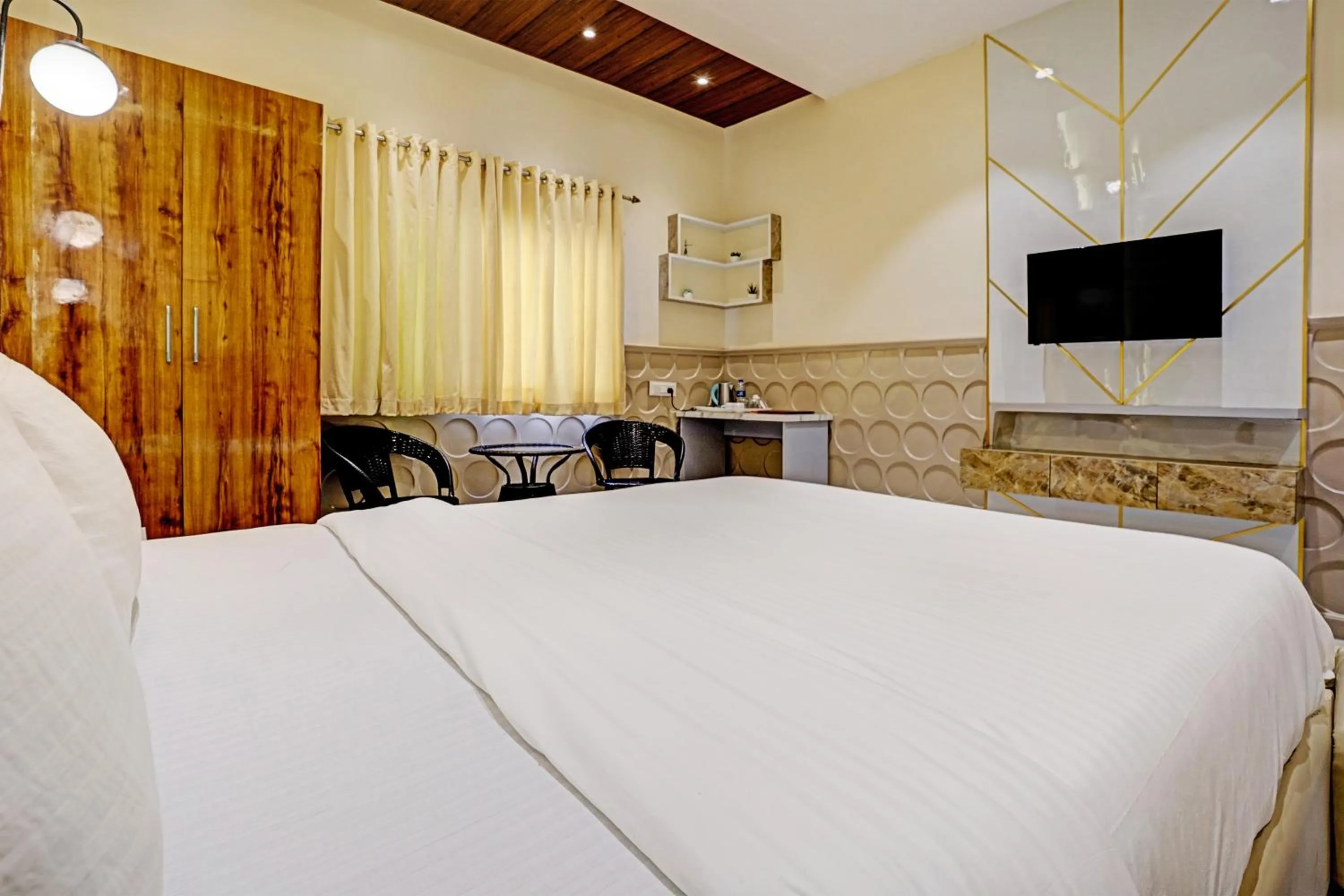 Bedroom, TV/Entertainment Center in Collection O Palm Springs Beach Resort