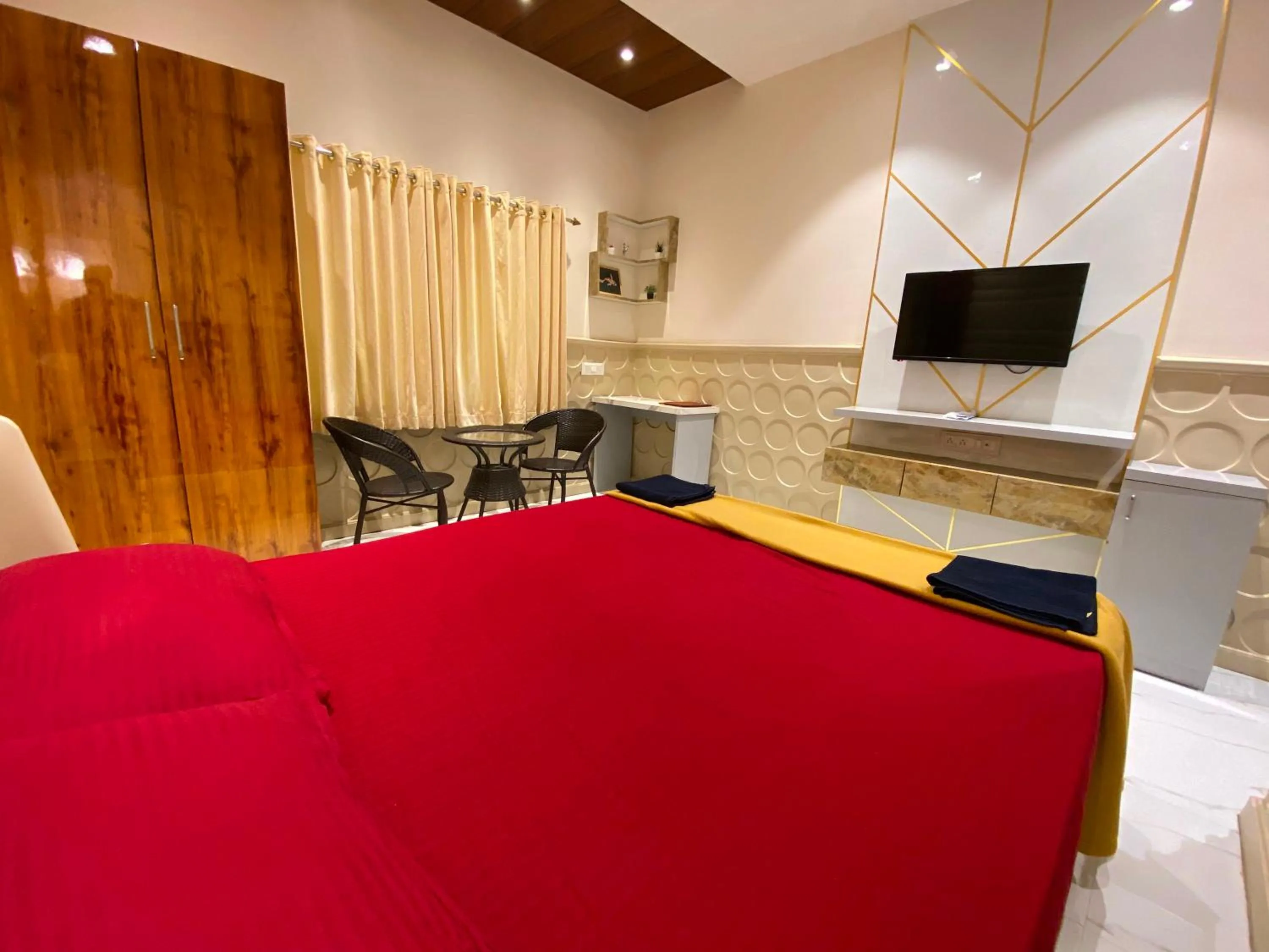 Bedroom, TV/Entertainment Center in Collection O Palm Springs Beach Resort