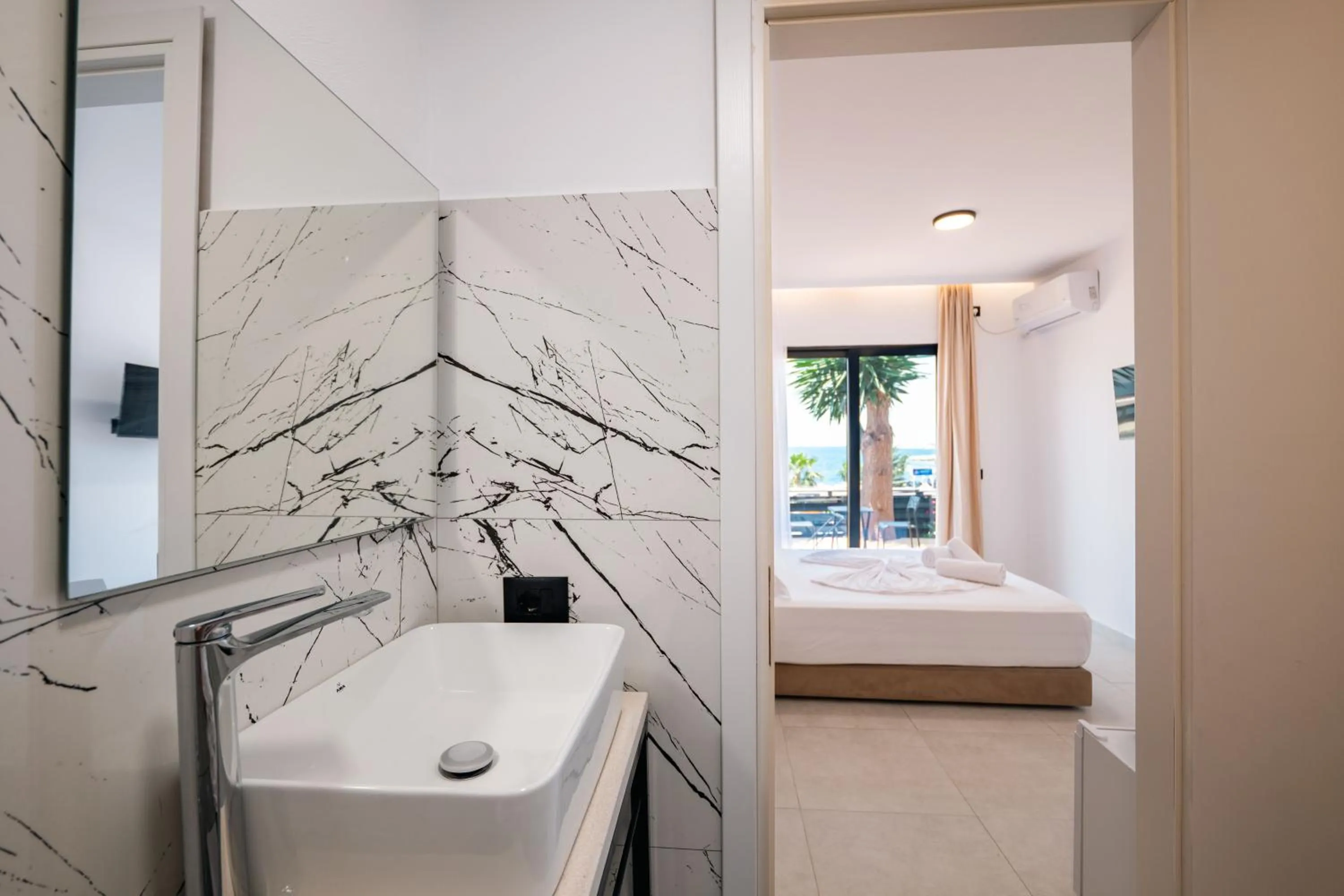 Bed in Sunset Aparthotel