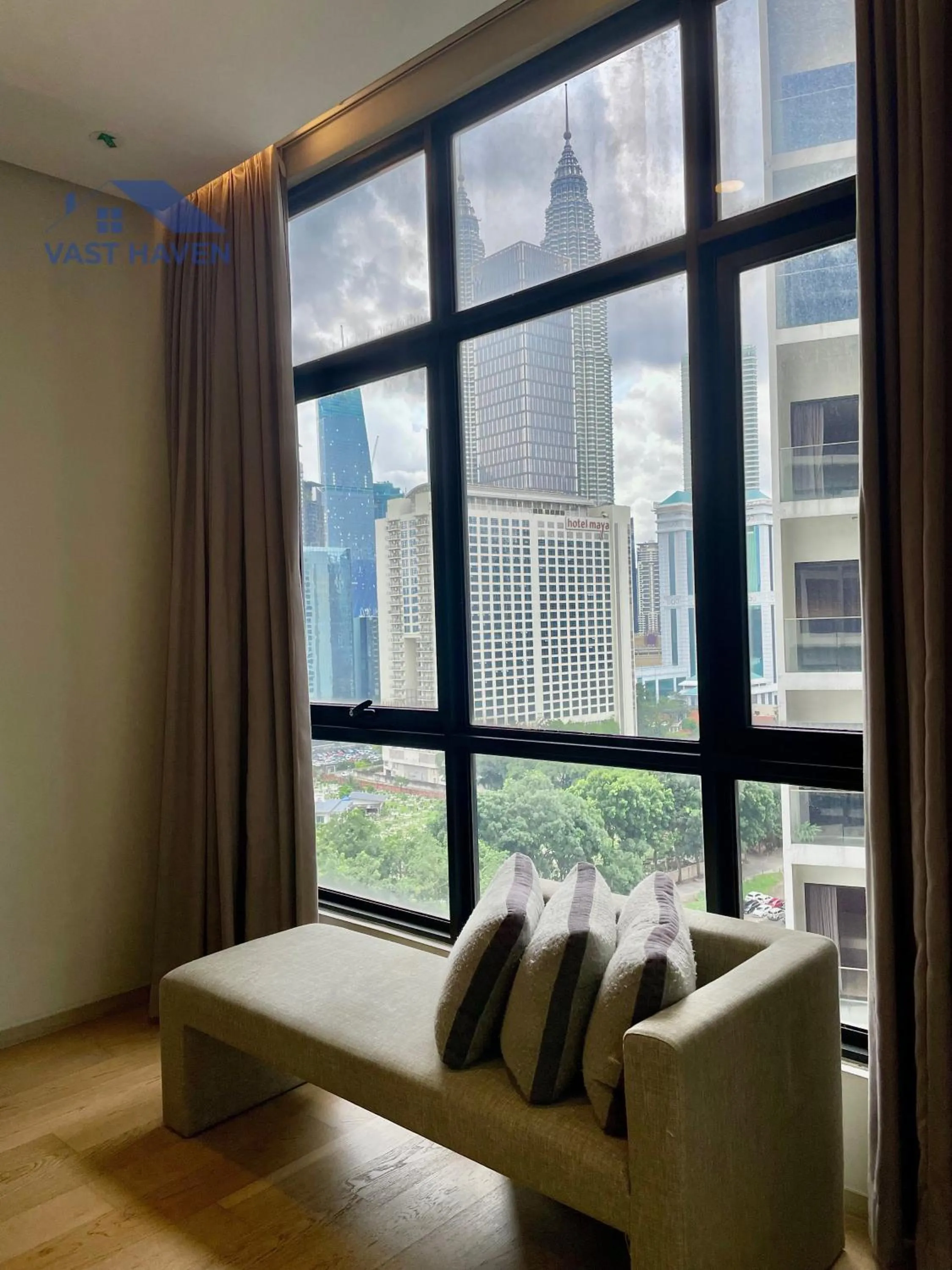 Seating area in 188 Suites KLCC by VastHaven