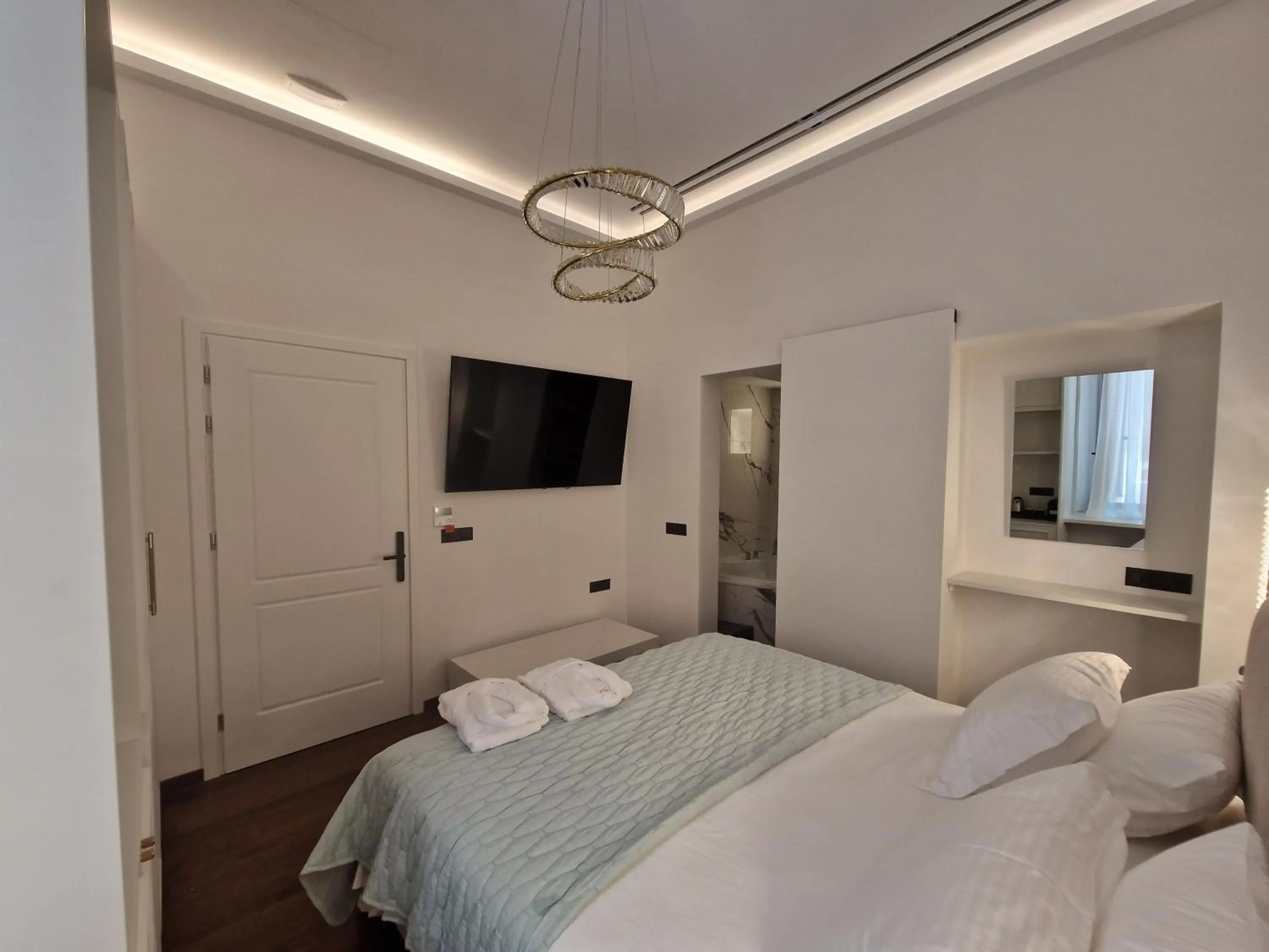 Bed in Jensen Luxury Suites