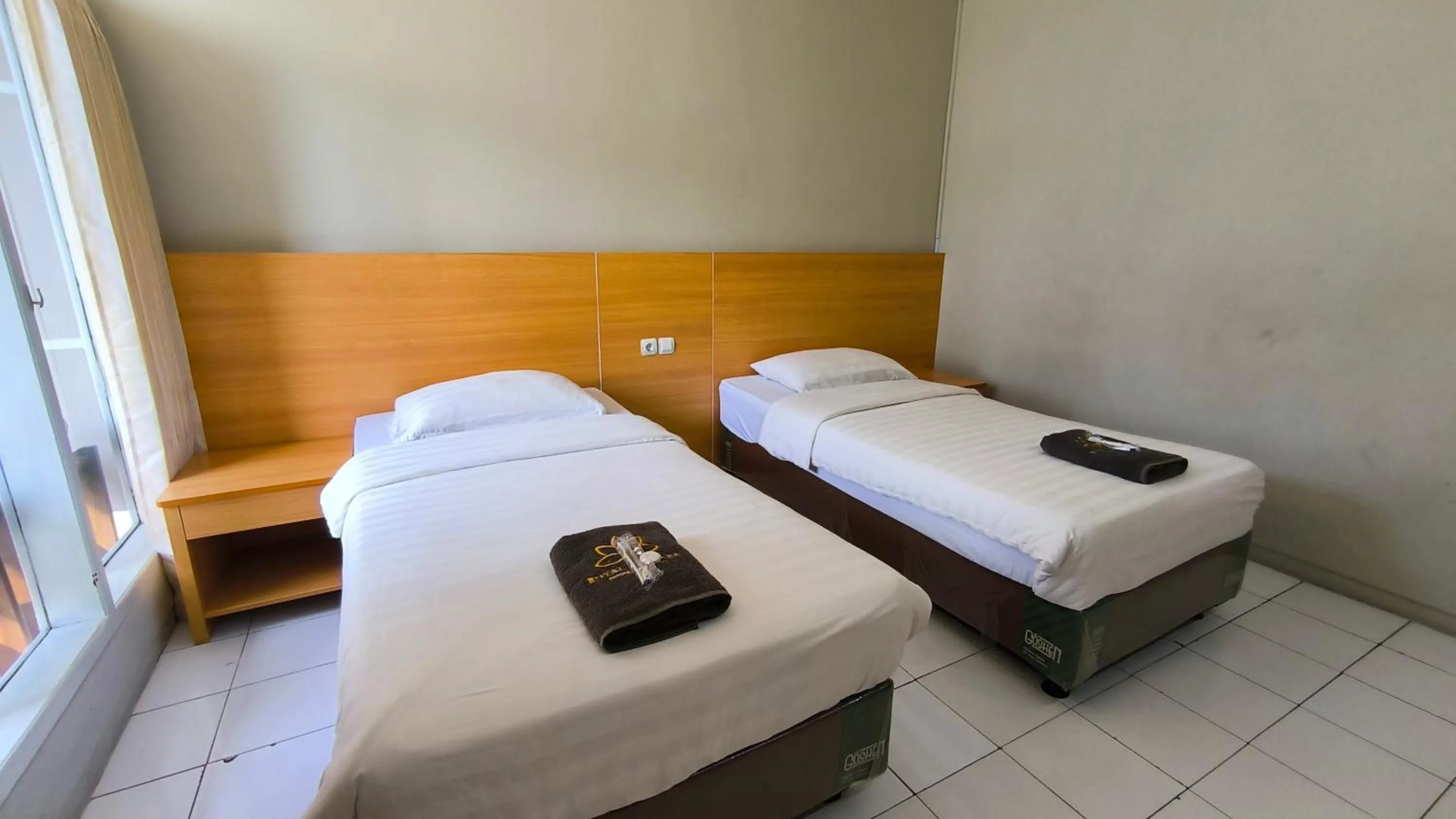 Bed in Royal Kencana Hotel powered by Cocotel