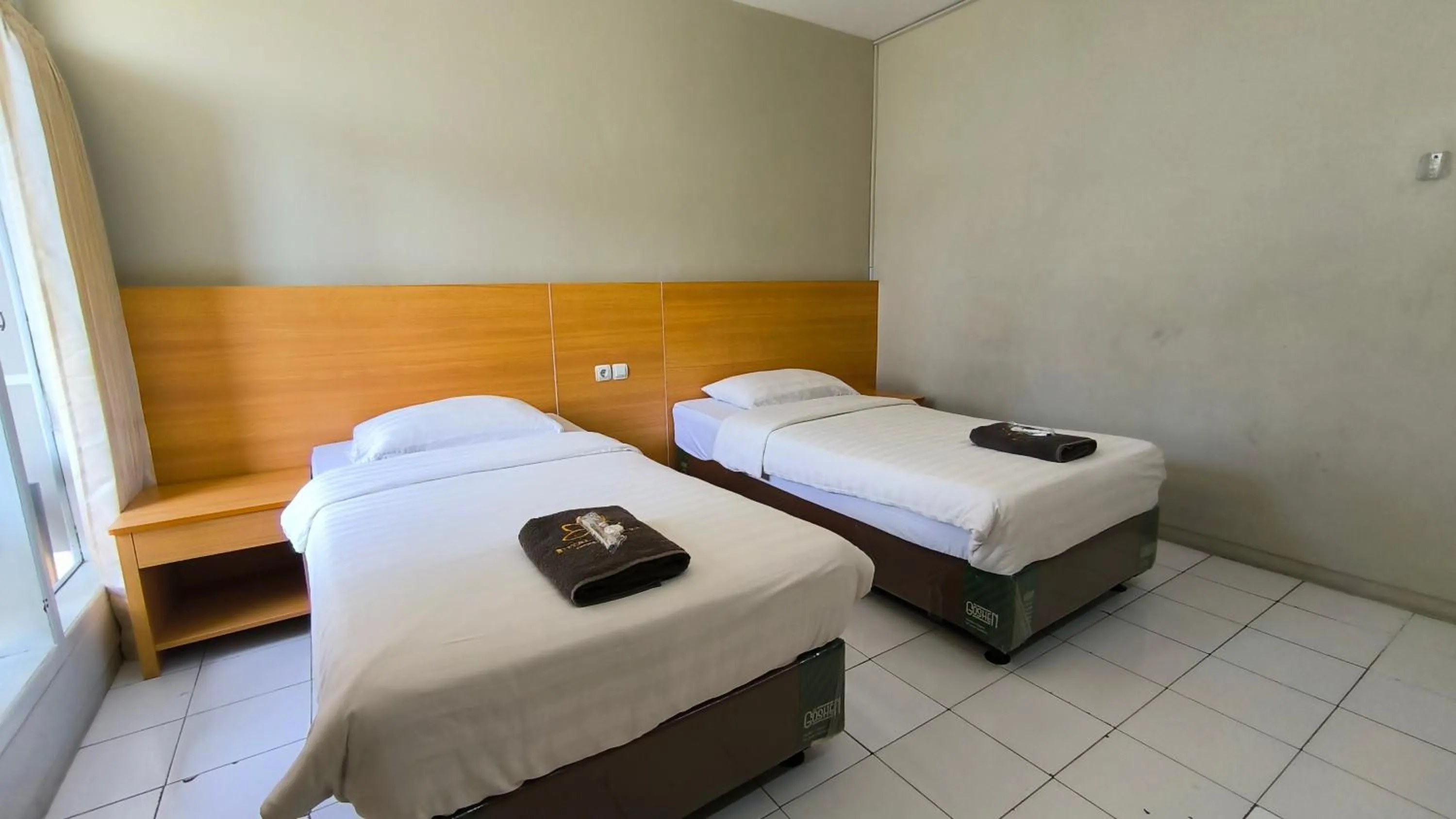 Bed in Royal Kencana Hotel powered by Cocotel