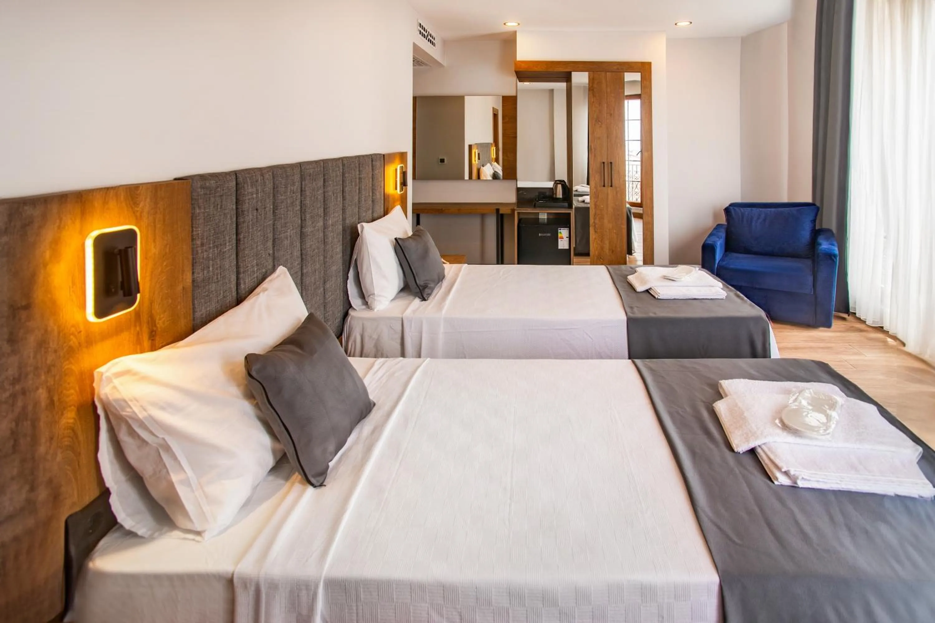 Bed in Grand Business Hotel