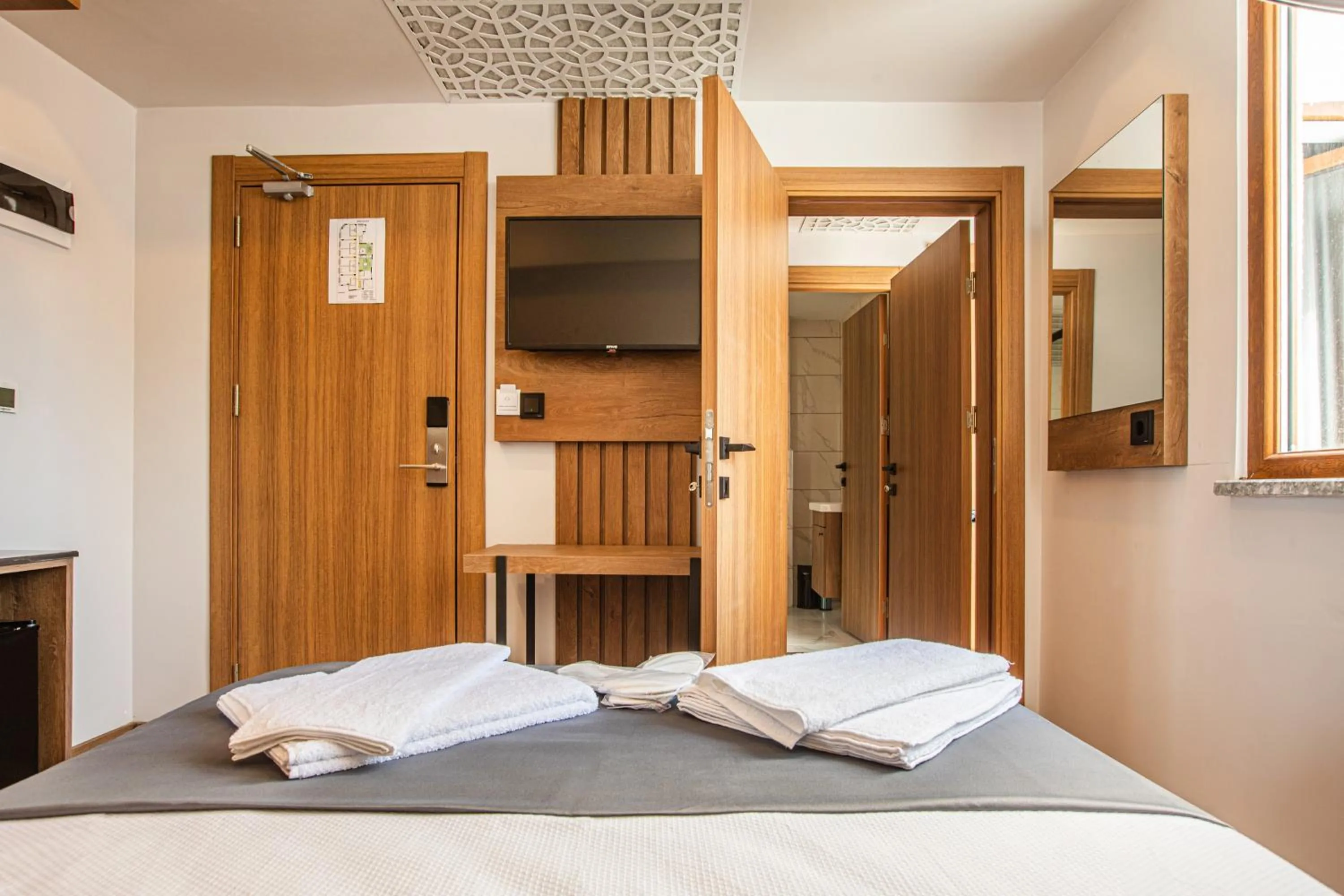 Bed in Grand Business Hotel