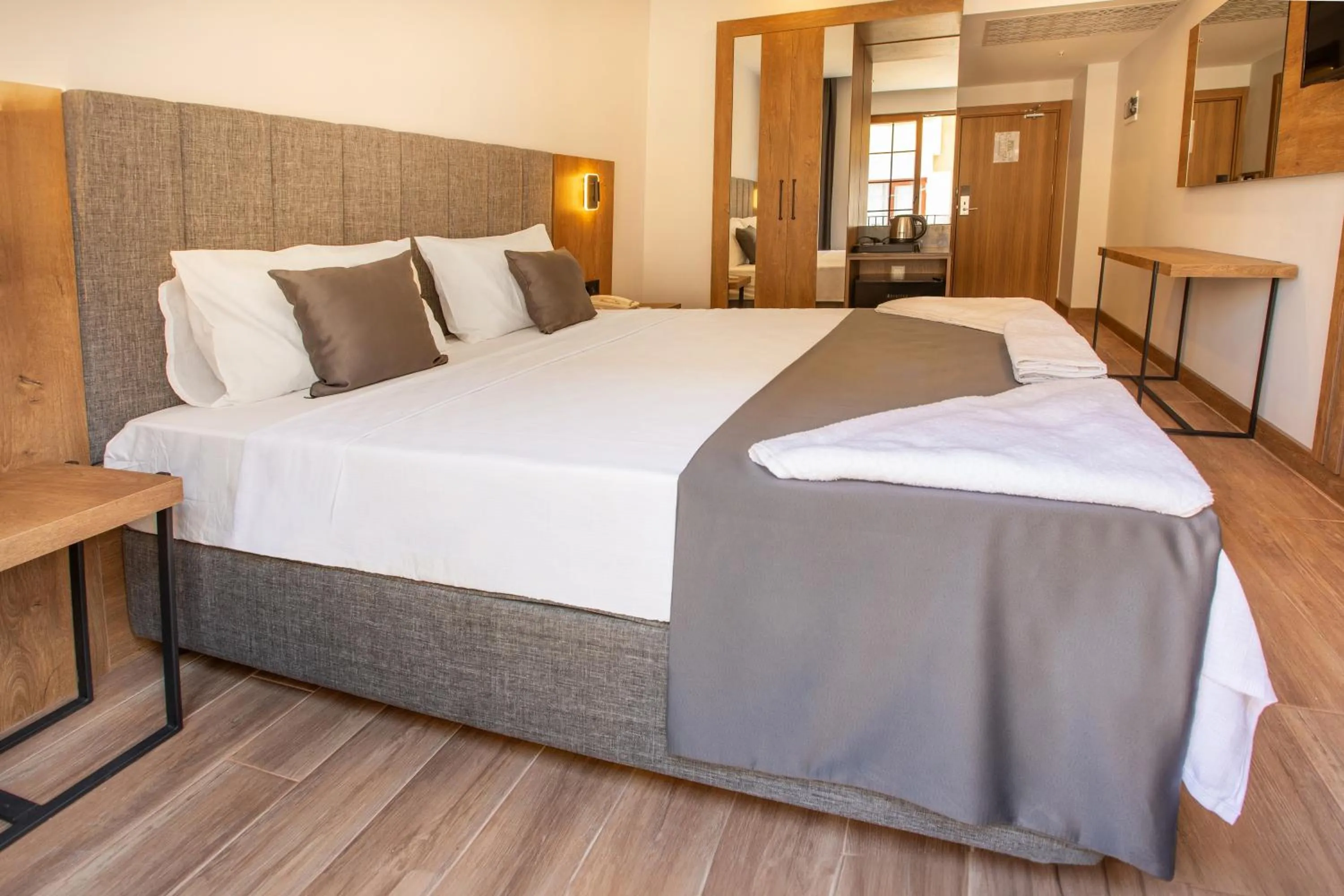 Bed in Grand Business Hotel