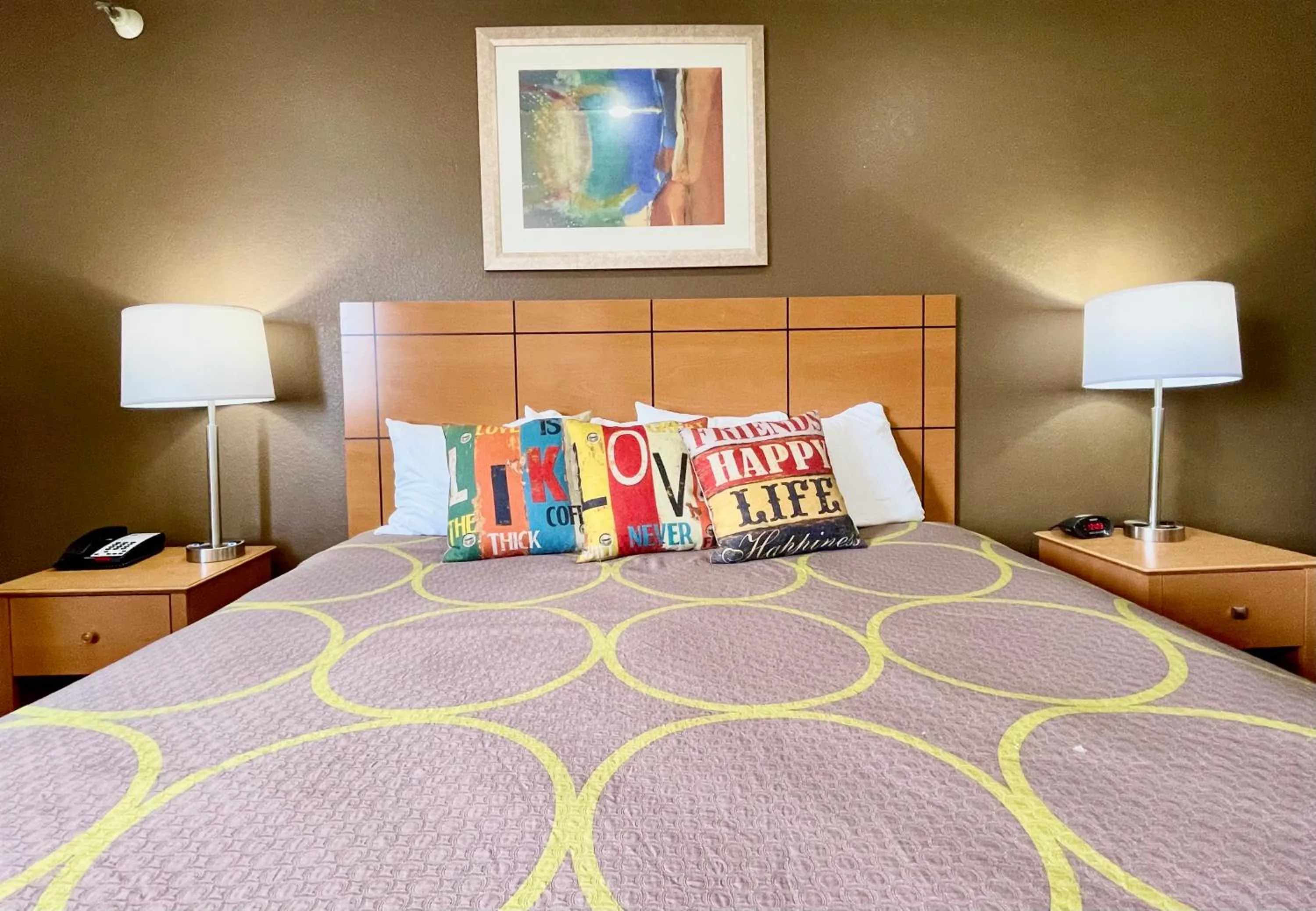 Bed in The Quincy Inn & Suites