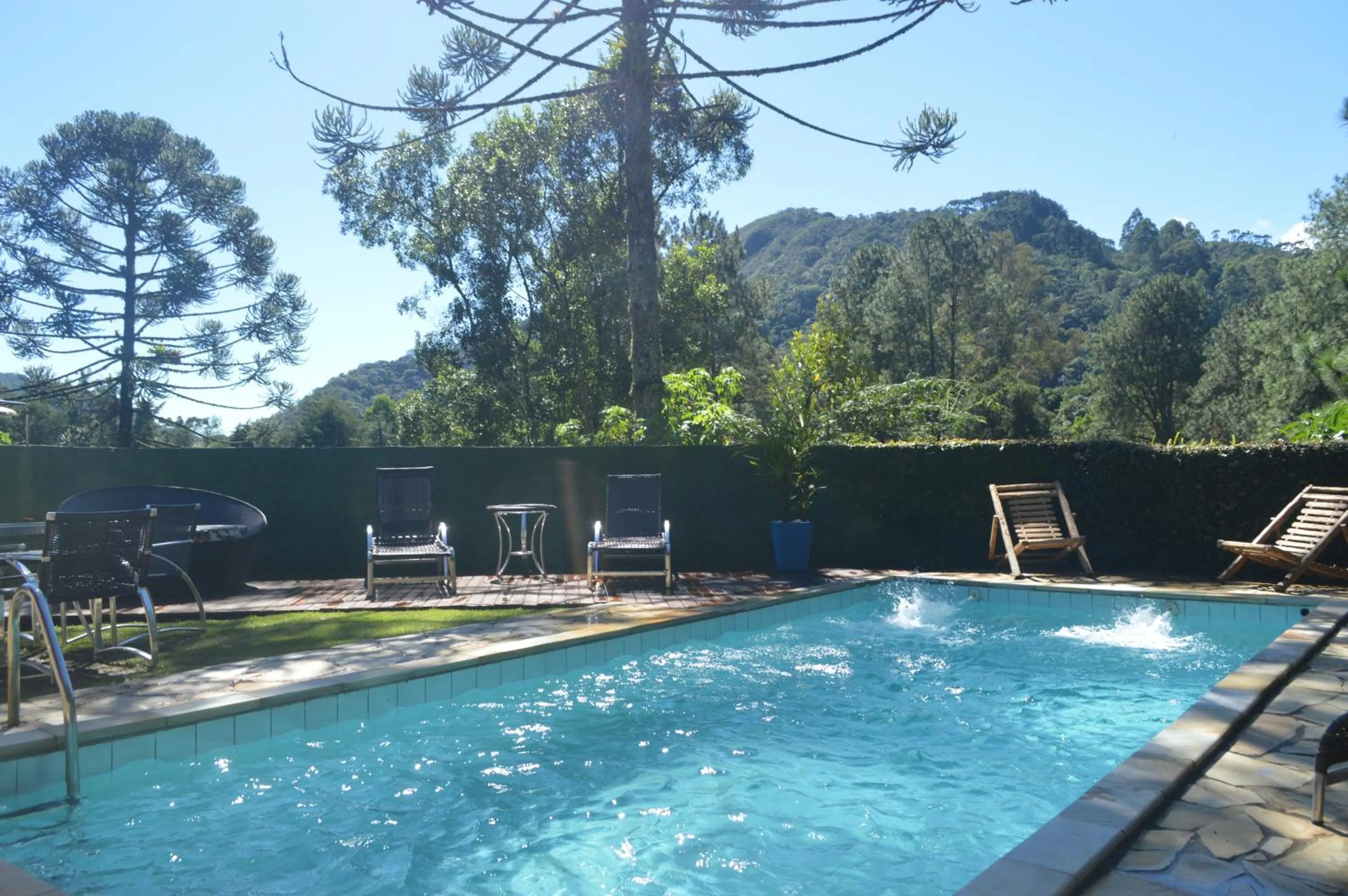 Swimming pool in Pousada Refúgio das Aves