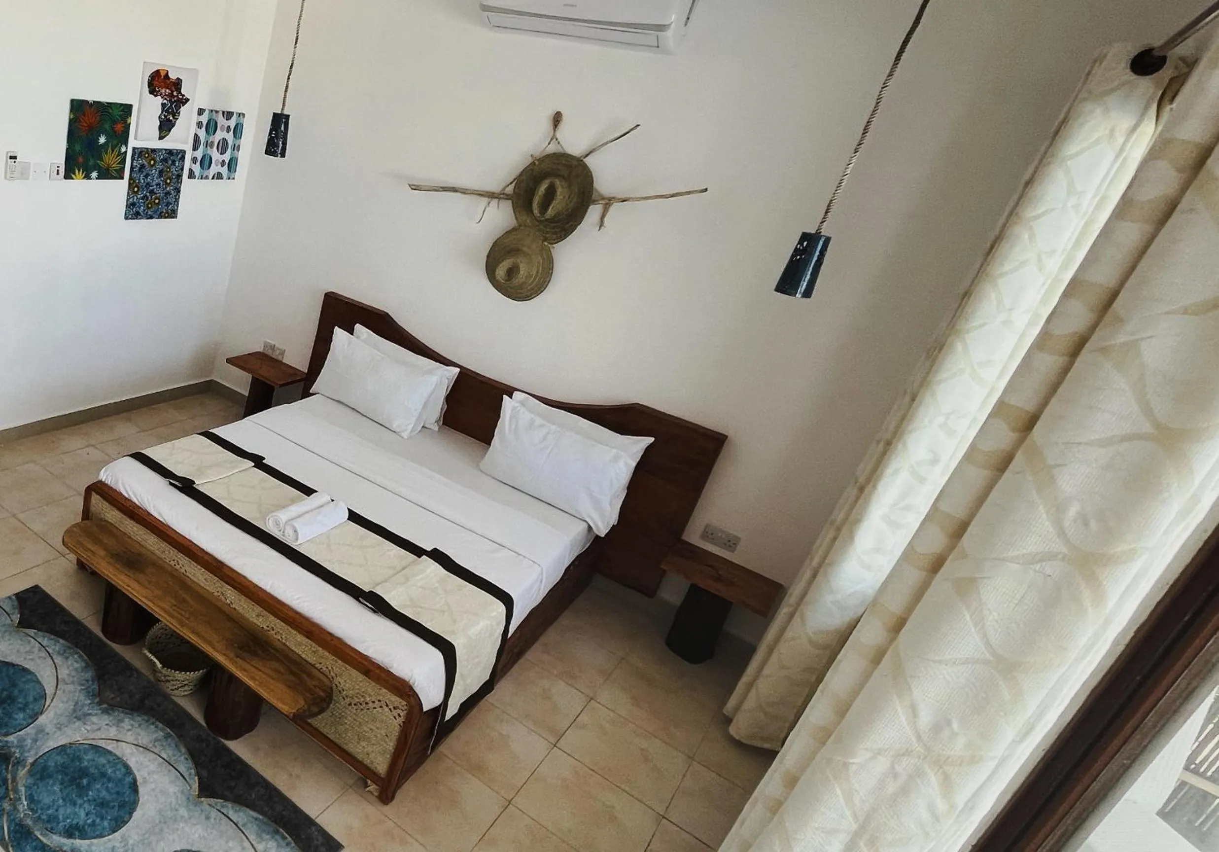 Bed in BIANCO AZZURRO Hotel & Restaurant