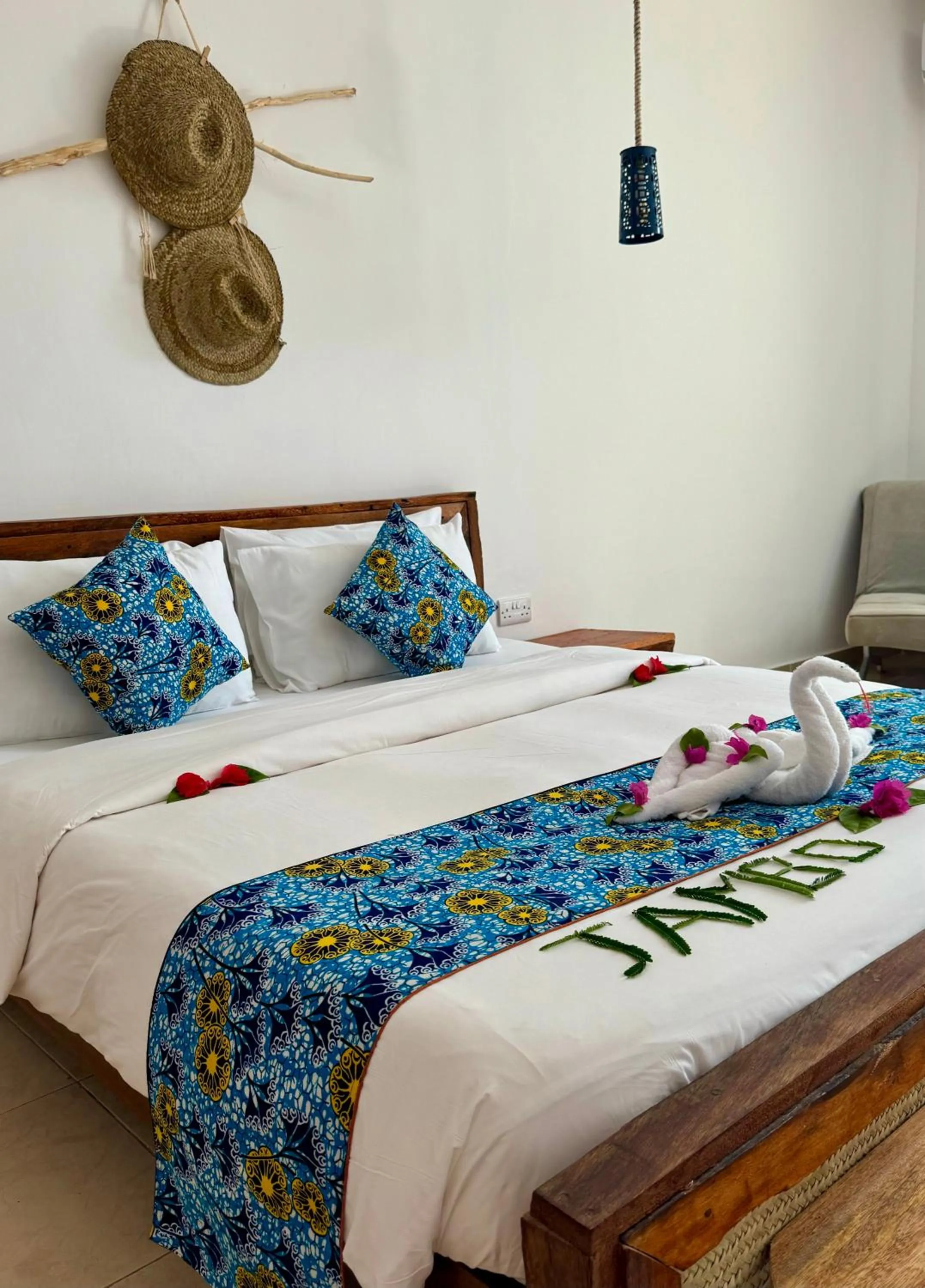 Bed in BIANCO AZZURRO Hotel & Restaurant