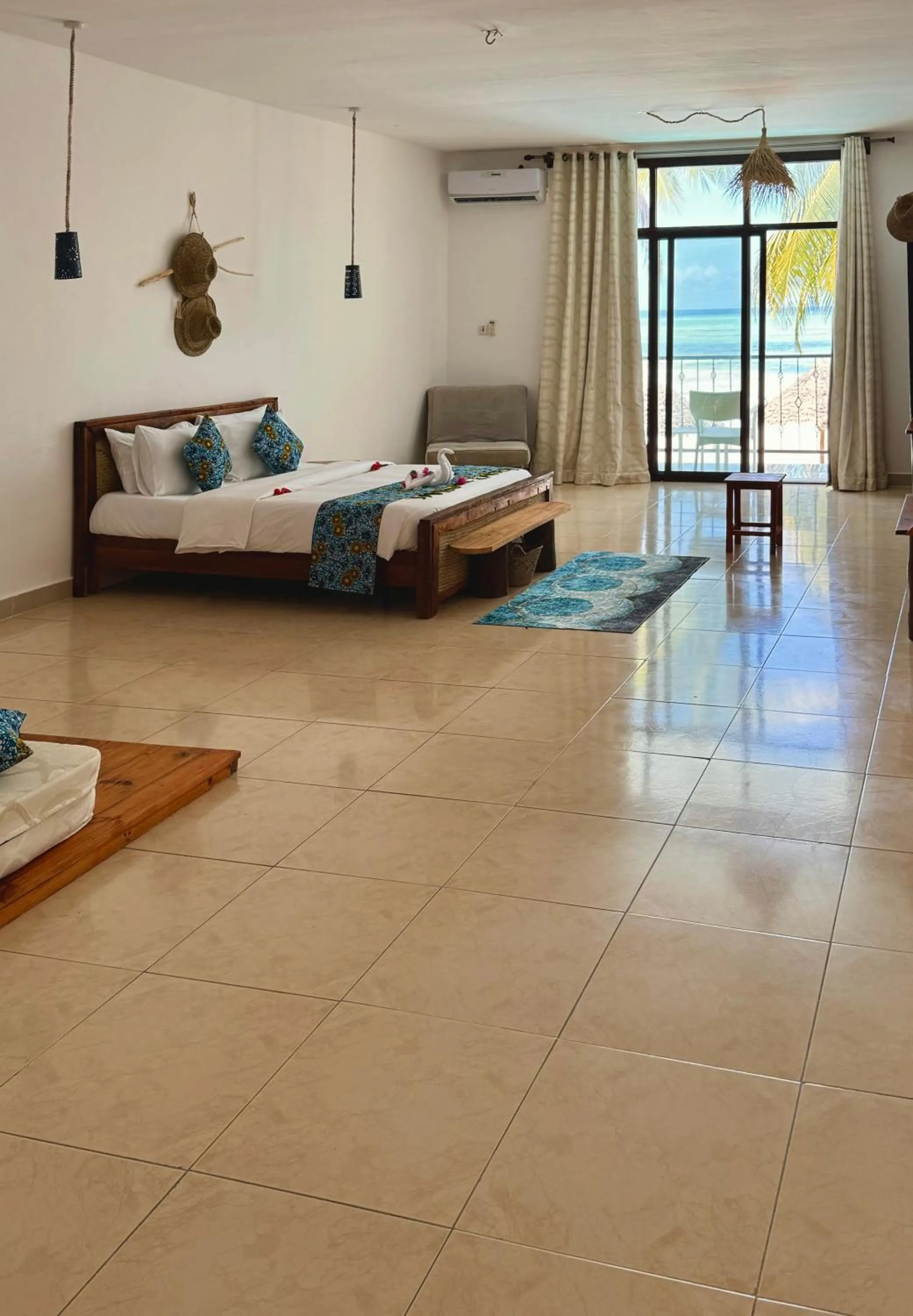 Bed in BIANCO AZZURRO Hotel & Restaurant