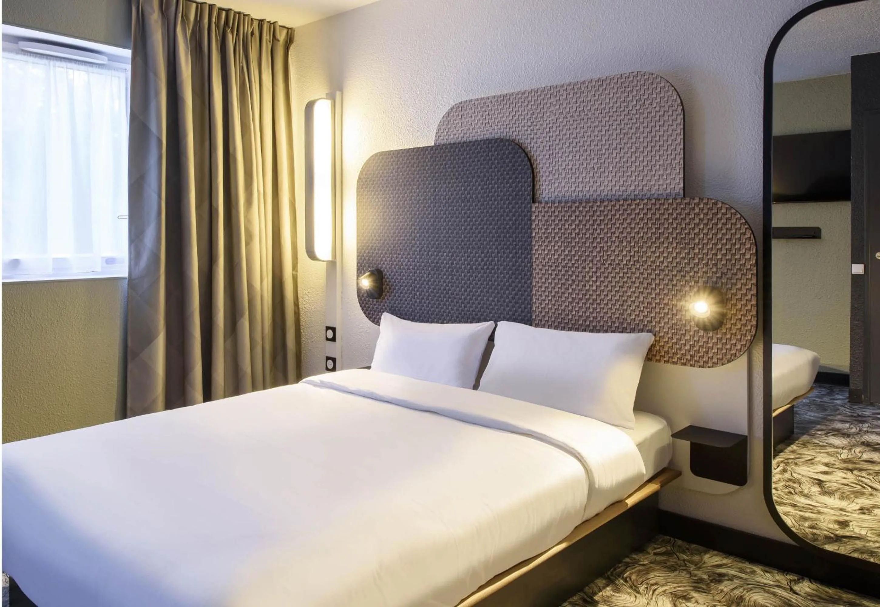 Bed in B&B HOTEL Toulouse Cité de l'Espace Gonord