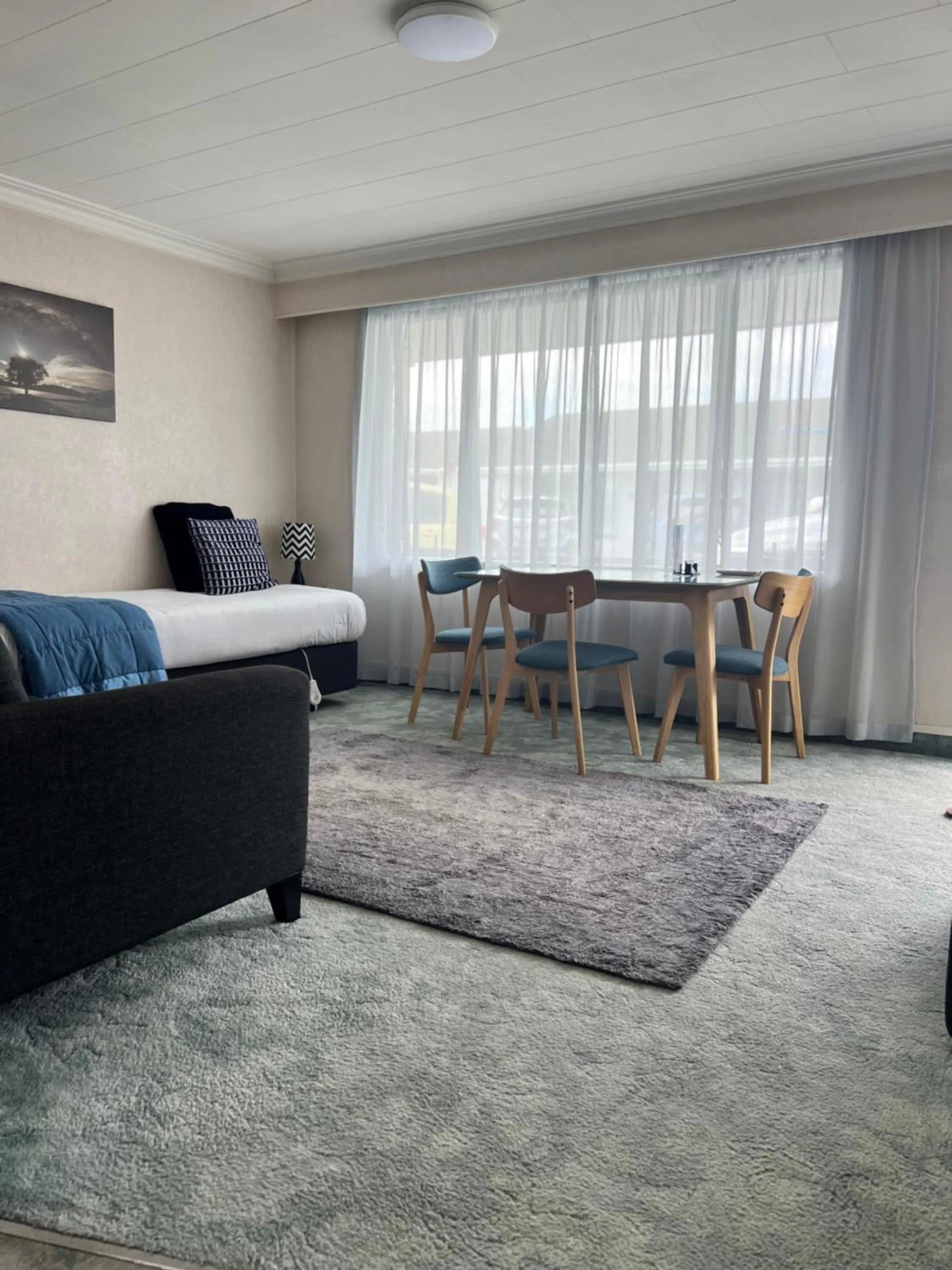 Seating area, Bed in ASURE Surrey Court Motel Invercargill