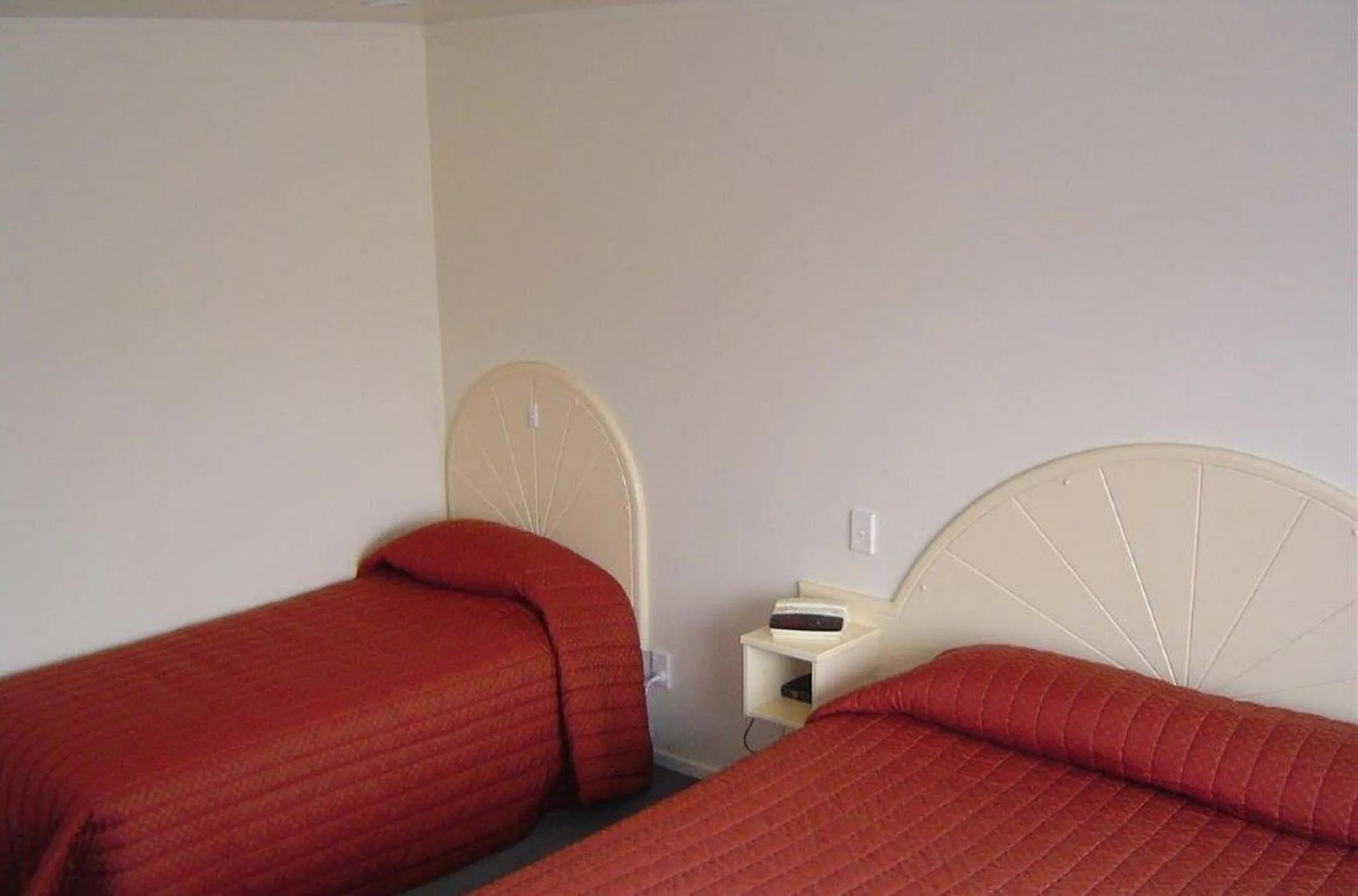 Bed in Valdez Motor Lodge