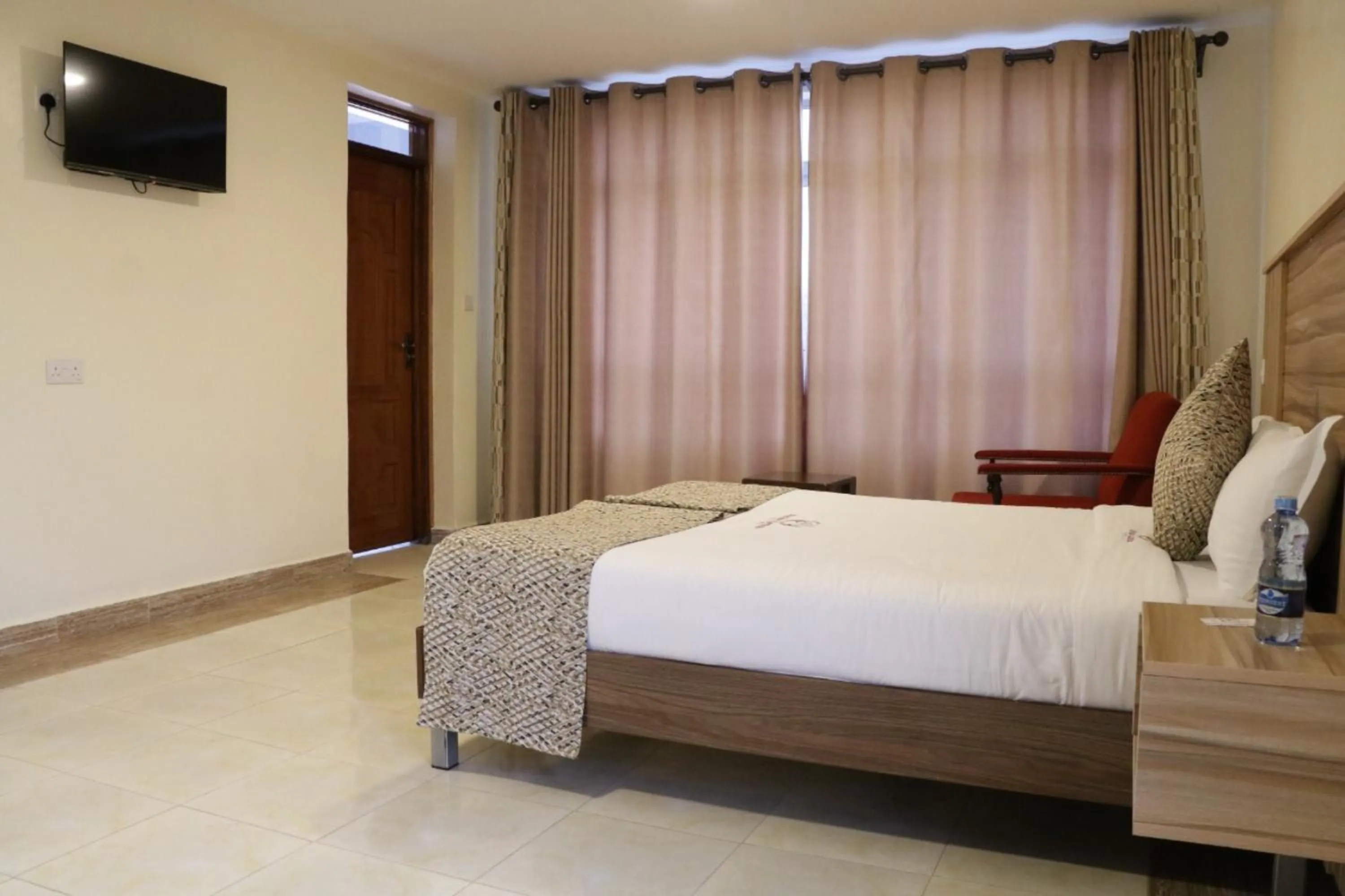 Bed in Paraiso Gardens Hotel