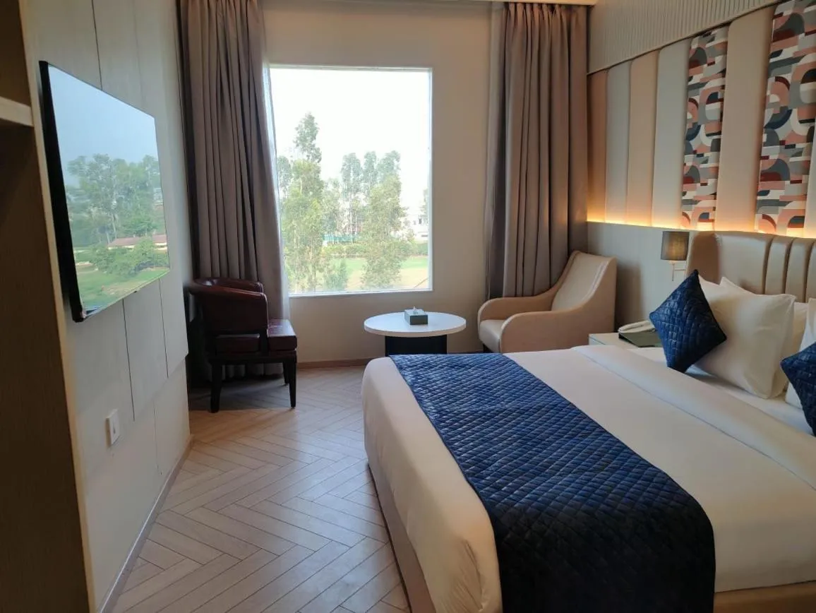 Bed in Chinmay Hotel & Resort