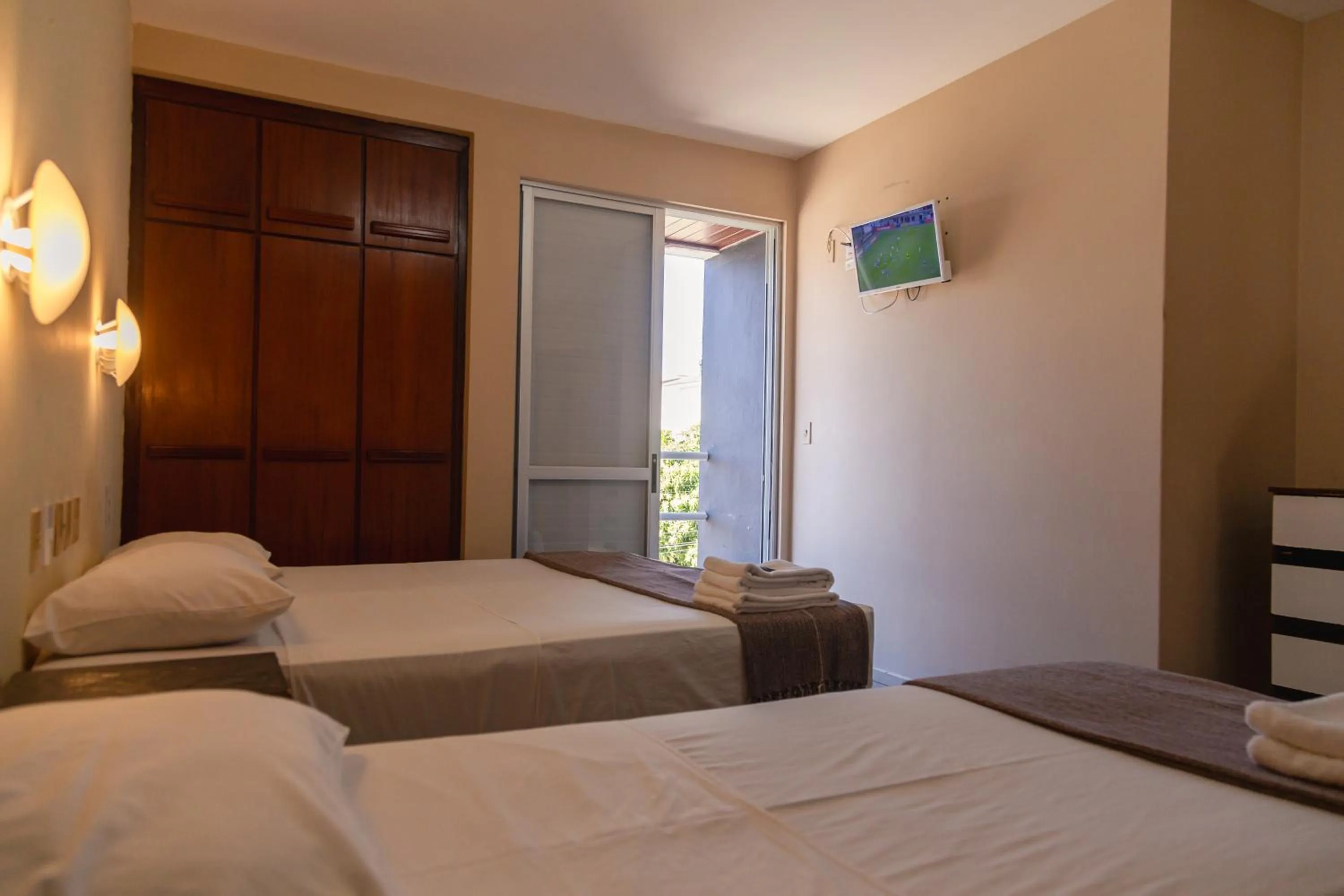 Photo of the whole room, Bed in HANNA Praia Hotel - Florianópolis